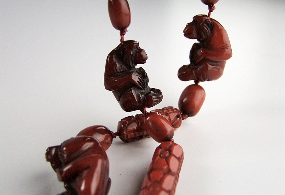 Vintage hand carved cherry amber beaded necklace