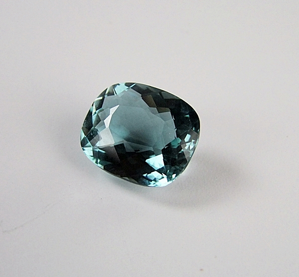 Loose cushion cushion cut teal green hued quartz gemstone