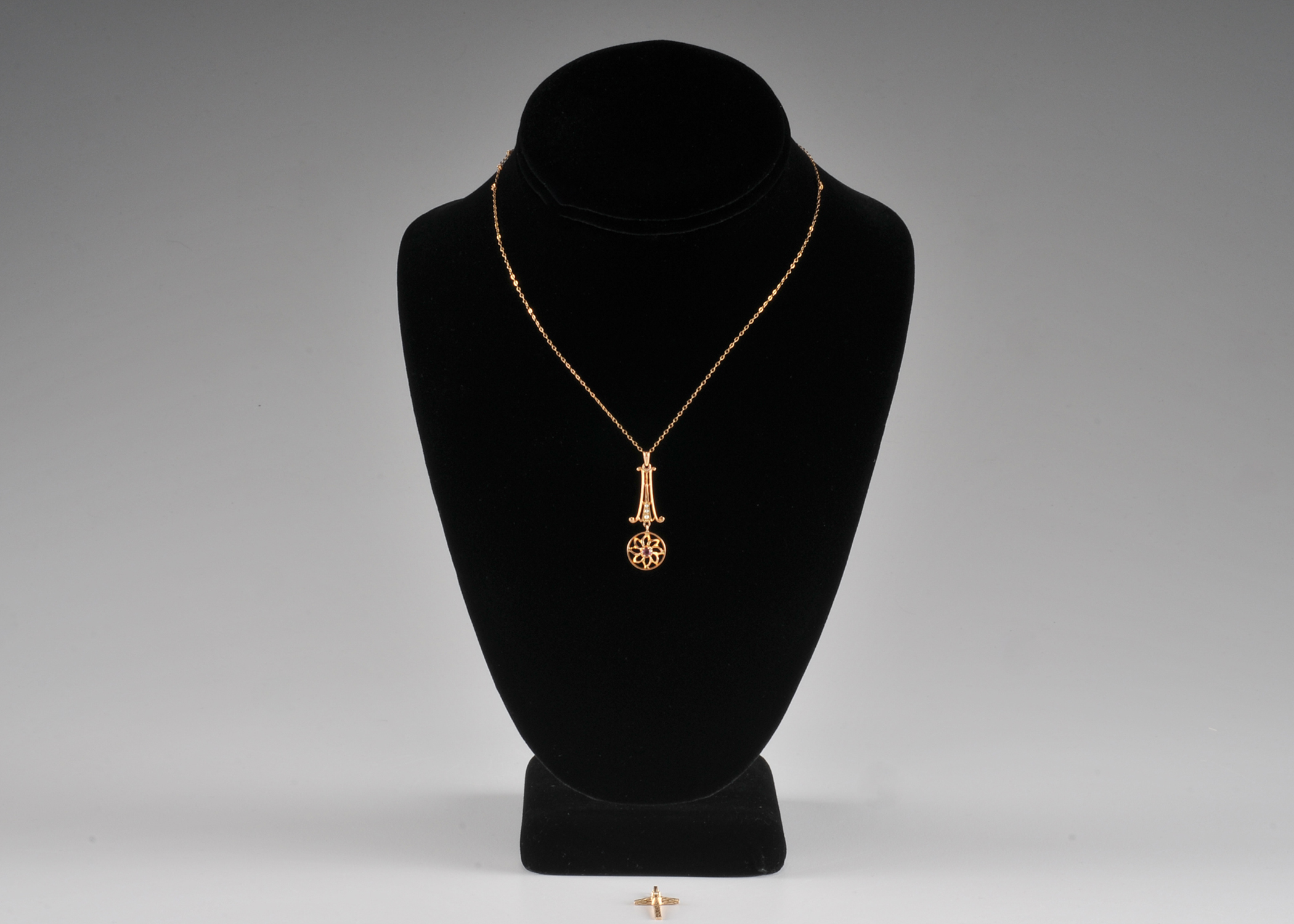  10 K yellow gold necklace and pendant and a 14 K yellow gold cross and diamond pendant 