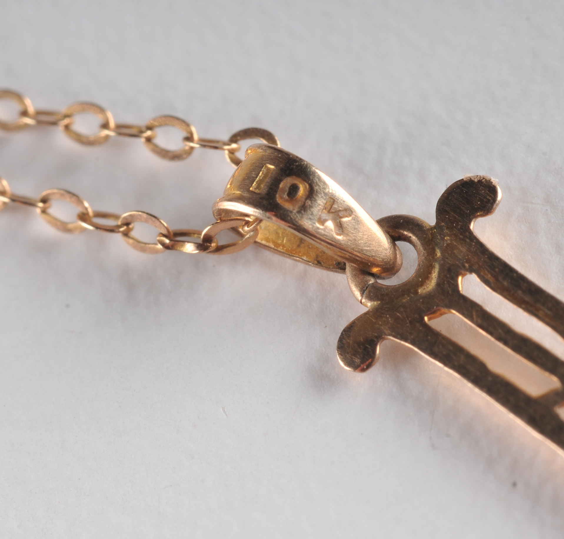  10 K yellow gold necklace and pendant and a 14 K yellow gold cross and diamond pendant 