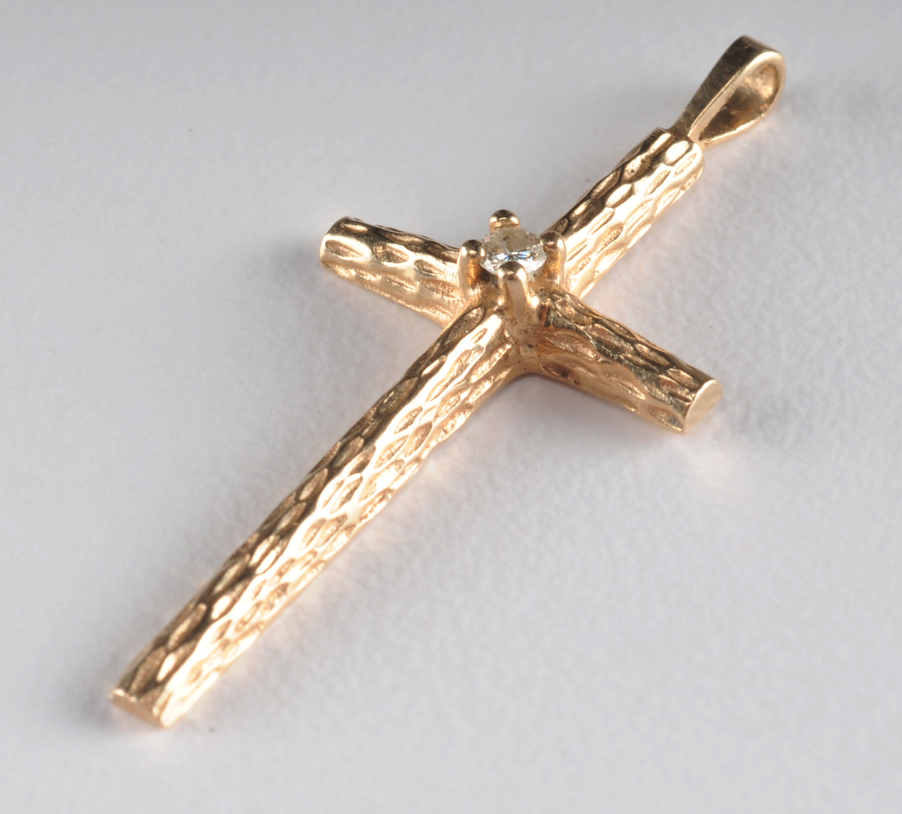  10 K yellow gold necklace and pendant and a 14 K yellow gold cross and diamond pendant 