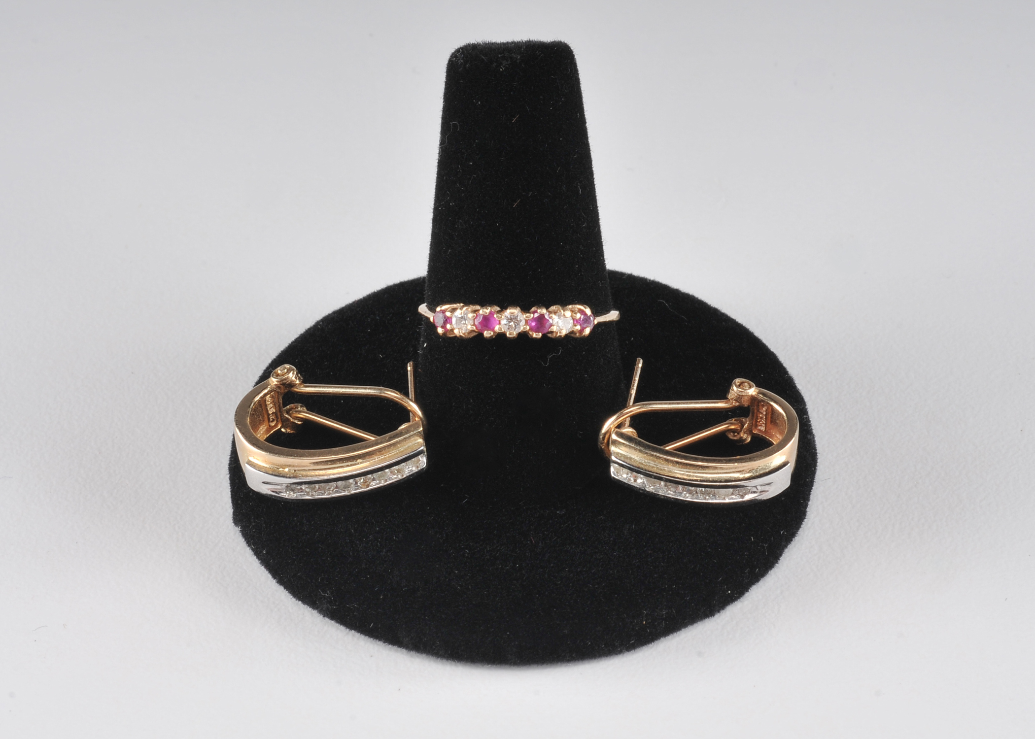 14 K yellow gold band with ruby and diamondsand a pair of 10 K two tone and diamond earrings