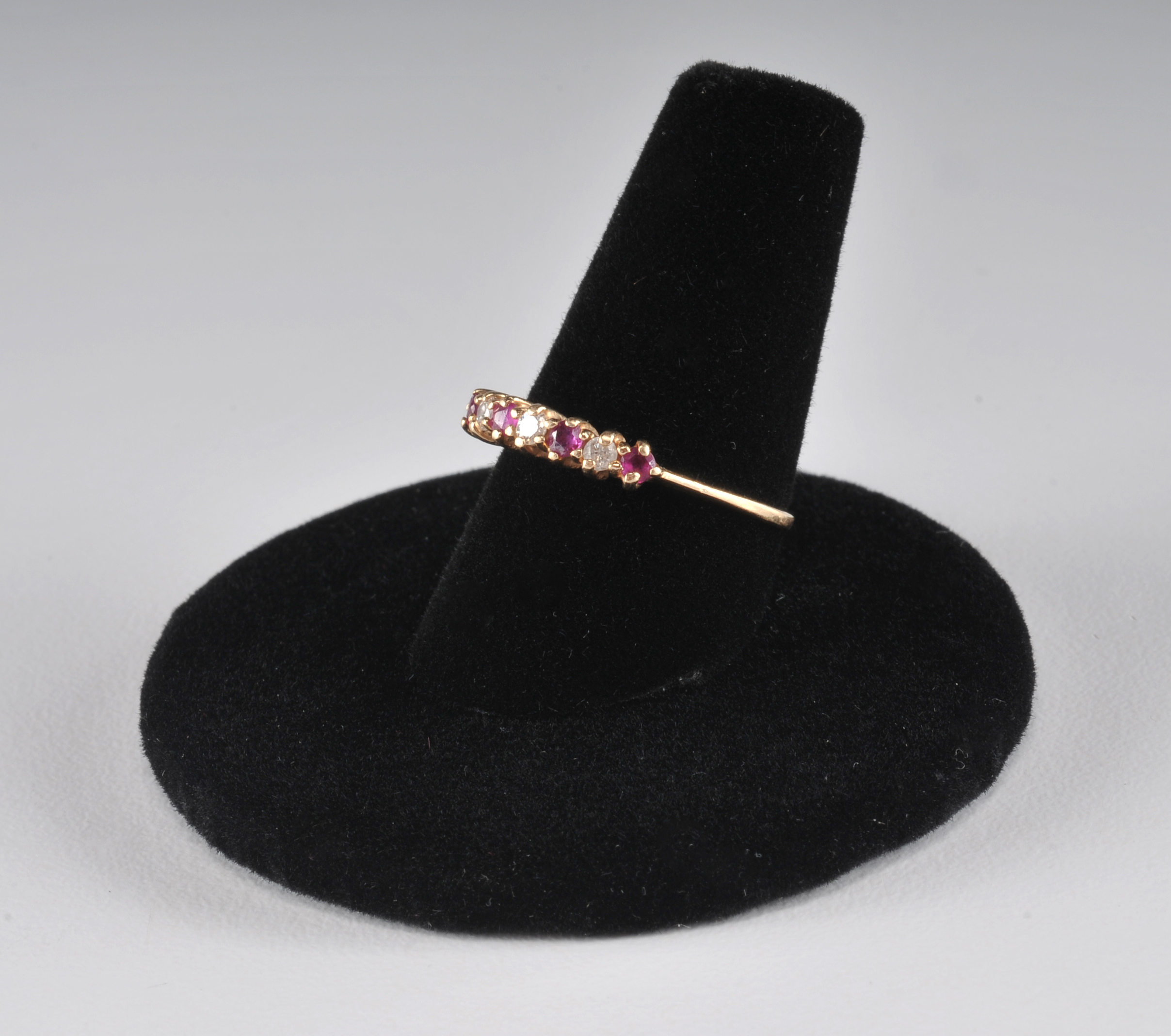 14 K yellow gold band with ruby and diamondsand a pair of 10 K two tone and diamond earrings