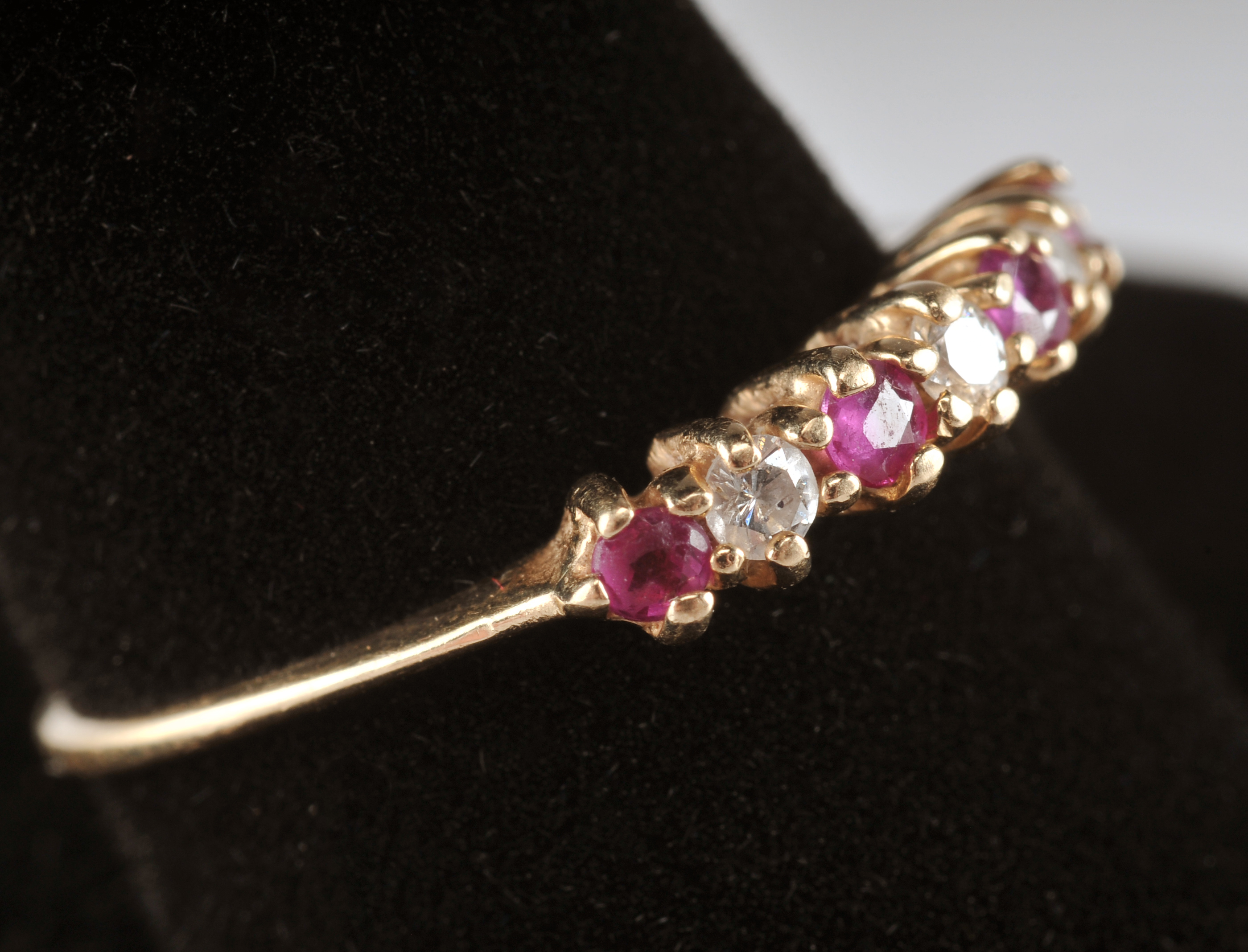 14 K yellow gold band with ruby and diamondsand a pair of 10 K two tone and diamond earrings