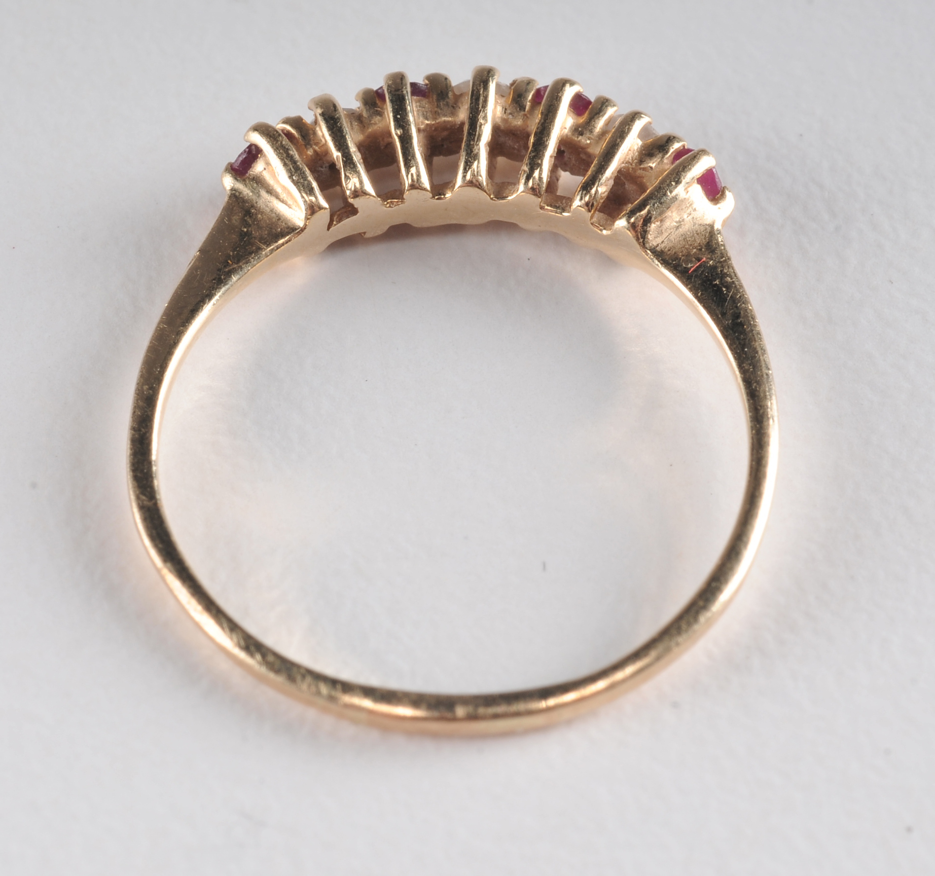 14 K yellow gold band with ruby and diamondsand a pair of 10 K two tone and diamond earrings