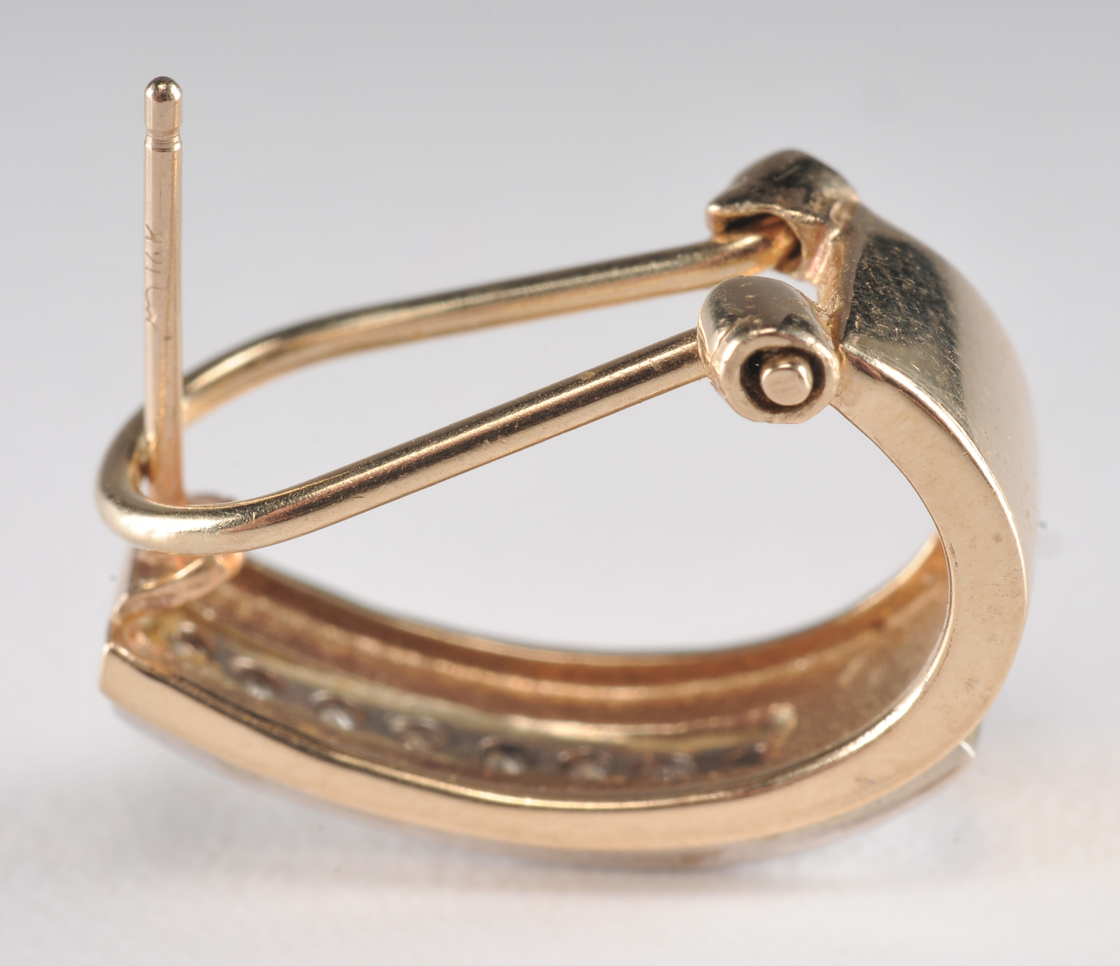 14 K yellow gold band with ruby and diamondsand a pair of 10 K two tone and diamond earrings