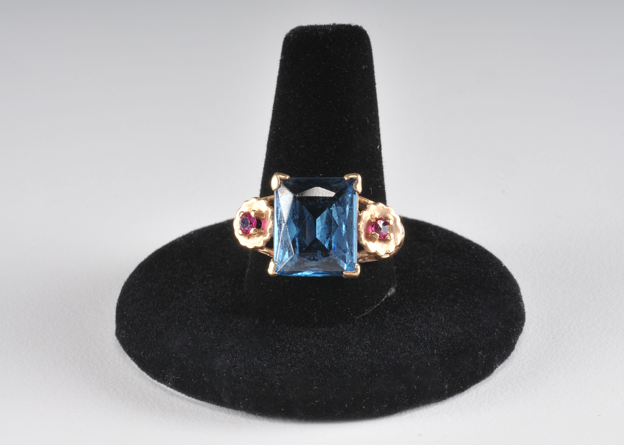 14 K yellow gold ladies cocktail ring with synthetic spinel and two  synthetic ruby red stones