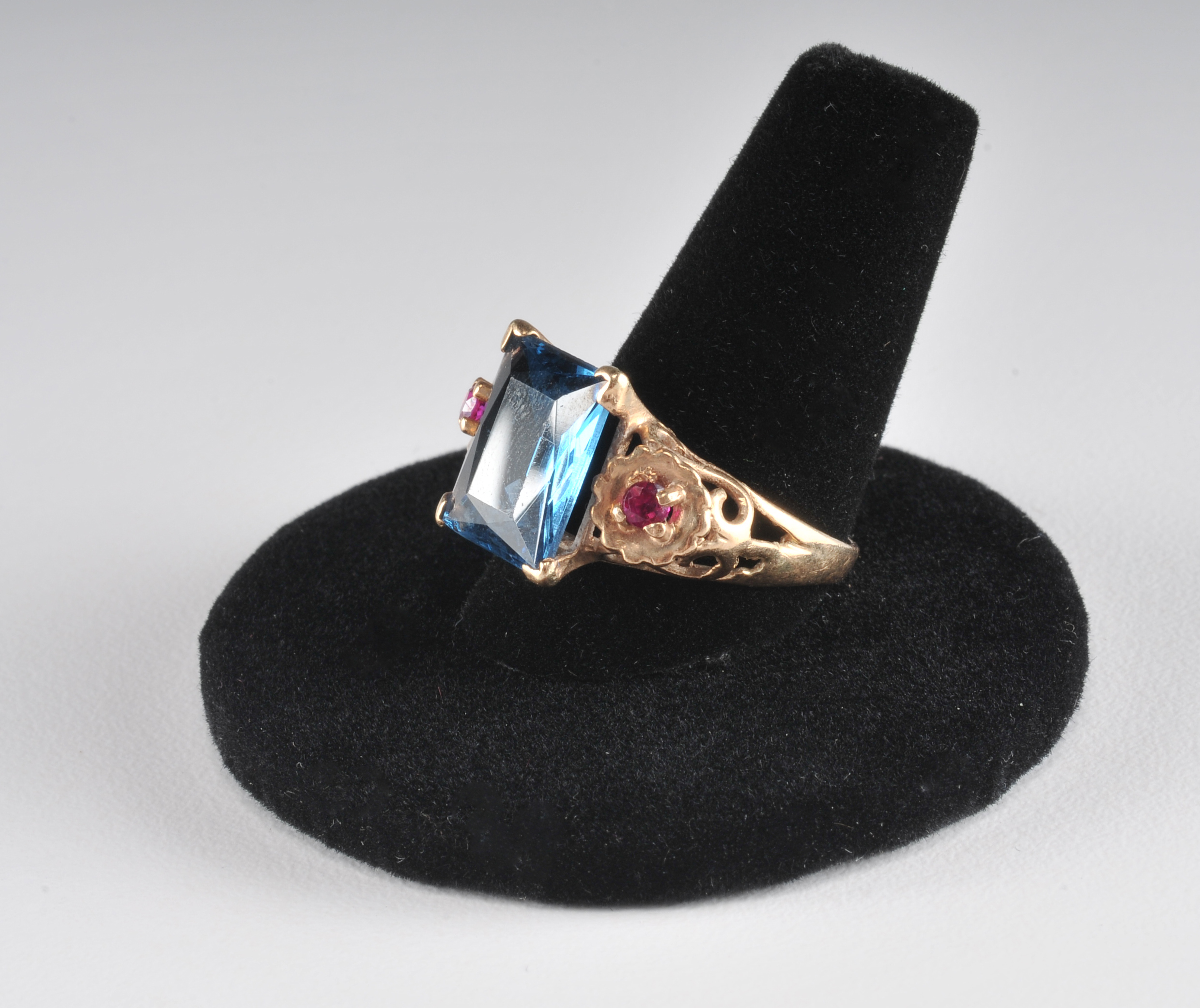 14 K yellow gold ladies cocktail ring with synthetic spinel and two  synthetic ruby red stones