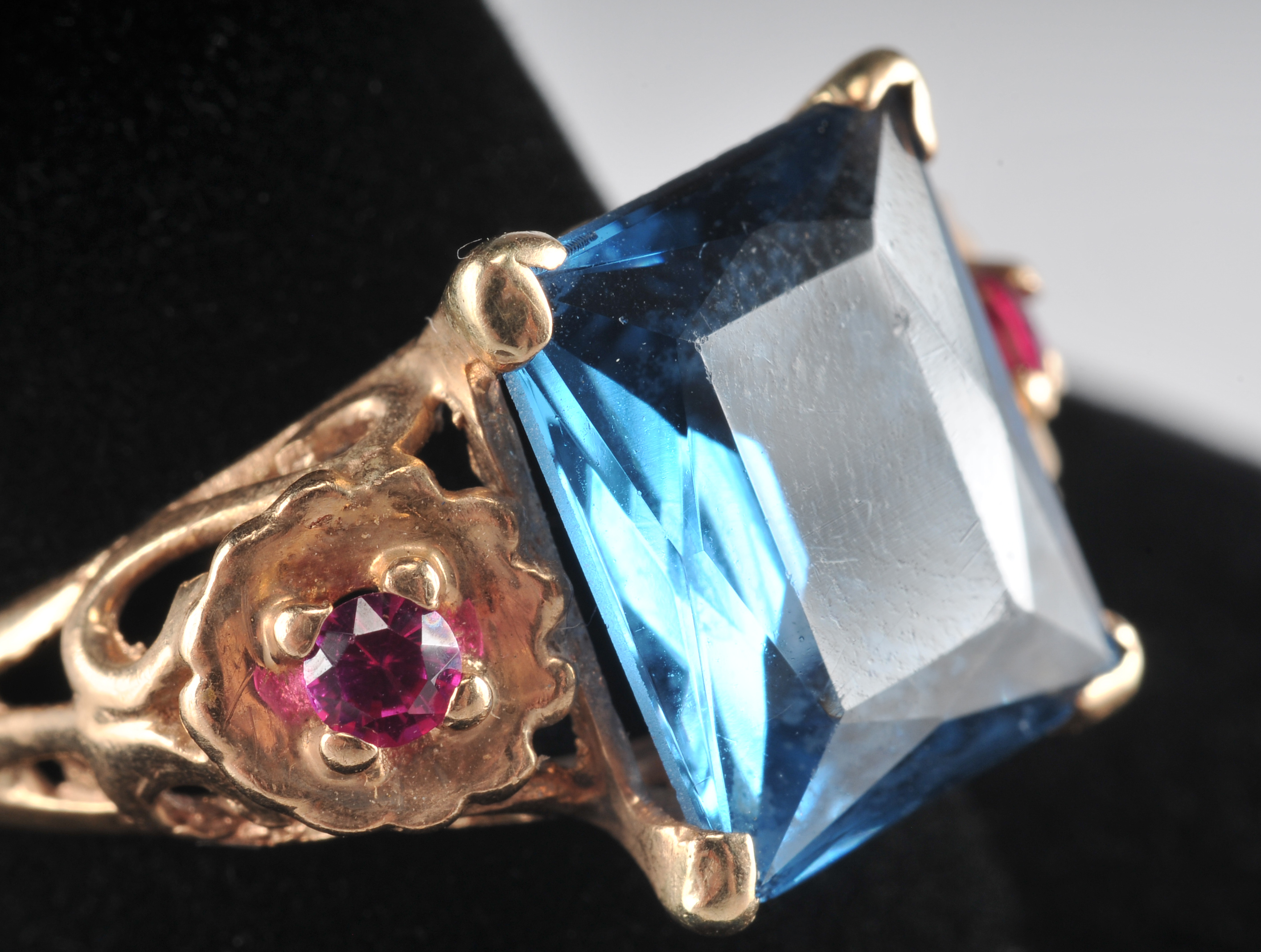 14 K yellow gold ladies cocktail ring with synthetic spinel and two  synthetic ruby red stones