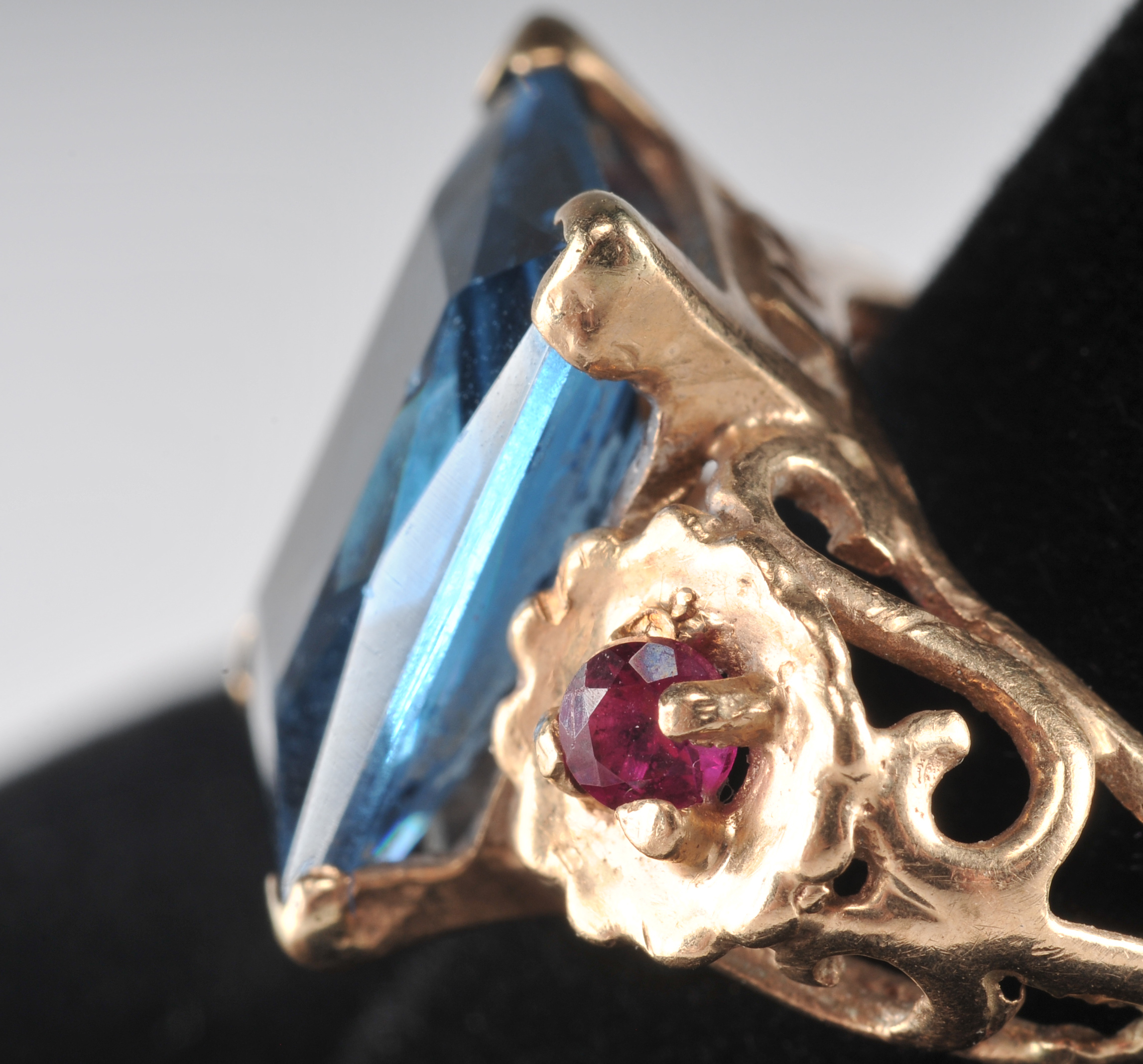 14 K yellow gold ladies cocktail ring with synthetic spinel and two  synthetic ruby red stones
