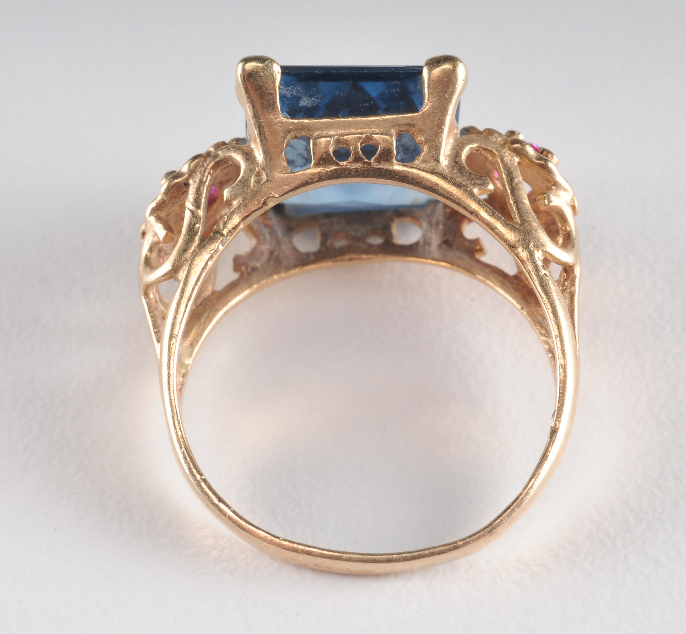 14 K yellow gold ladies cocktail ring with synthetic spinel and two  synthetic ruby red stones