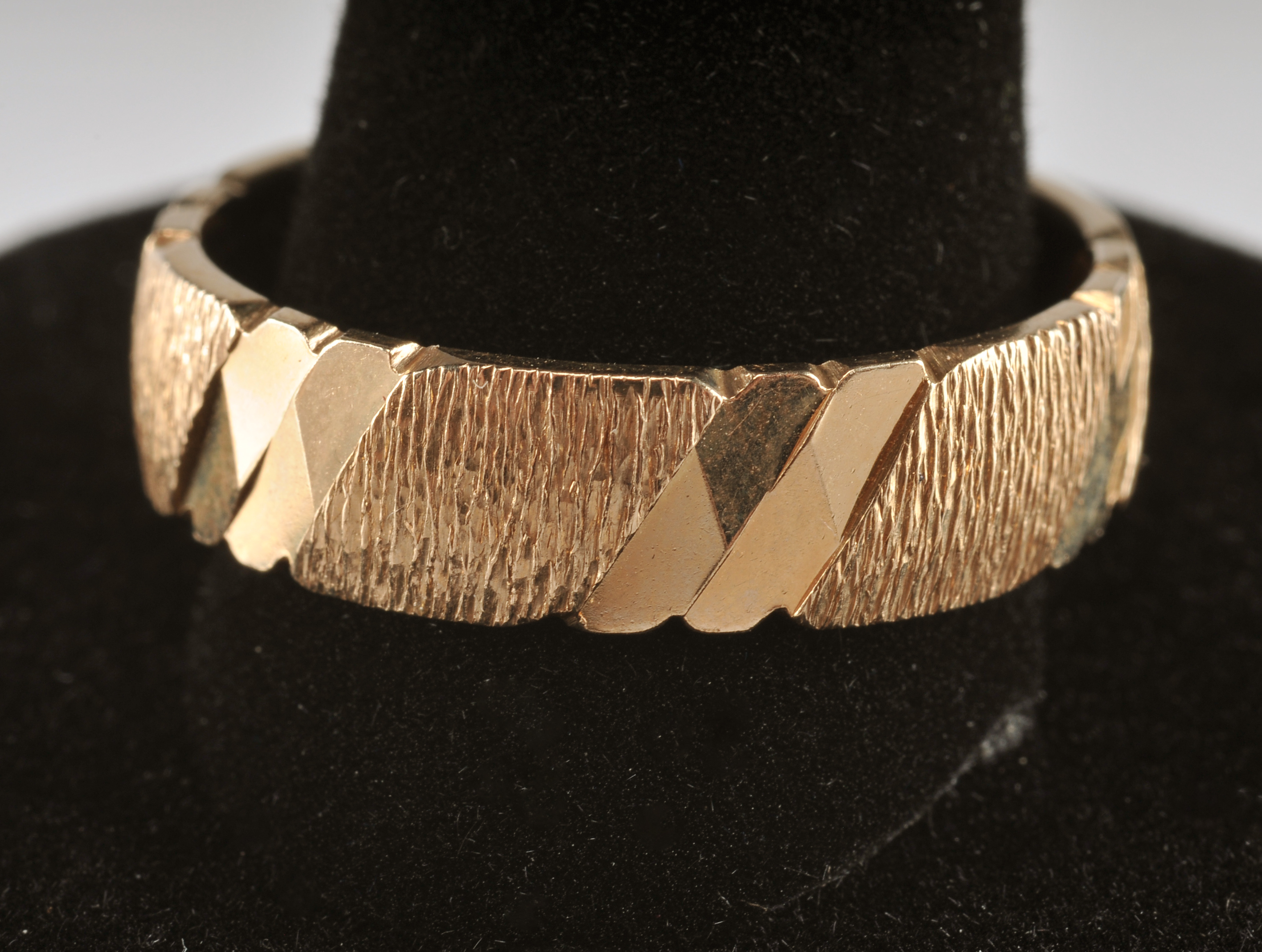 14 K yellow gold band with high polish bark design 