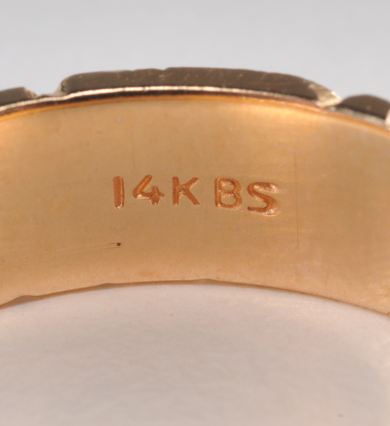 14 K yellow gold band with high polish bark design 