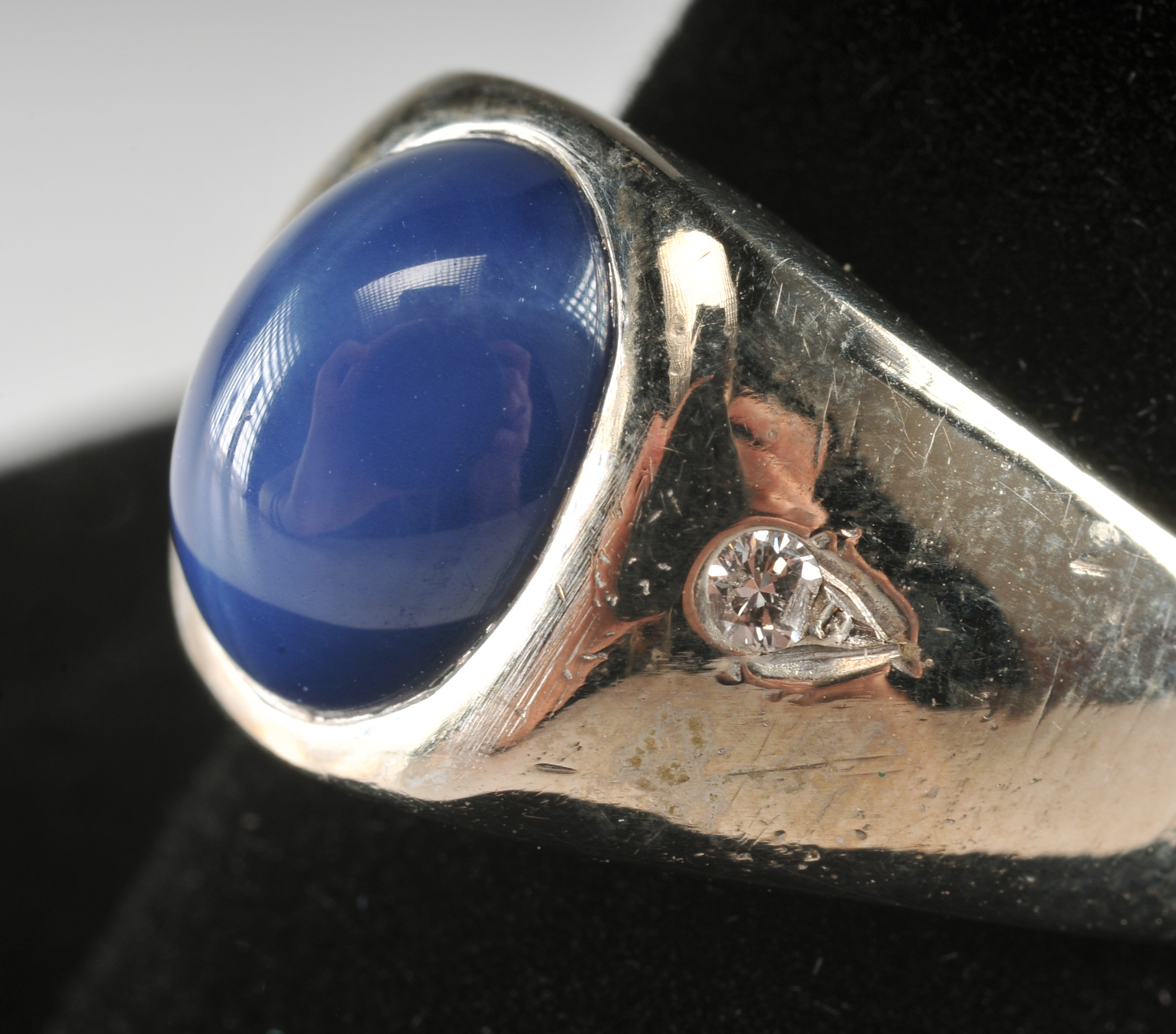 Ladies 14 K white gold ring with synthetic blue star sapphire and diamonds