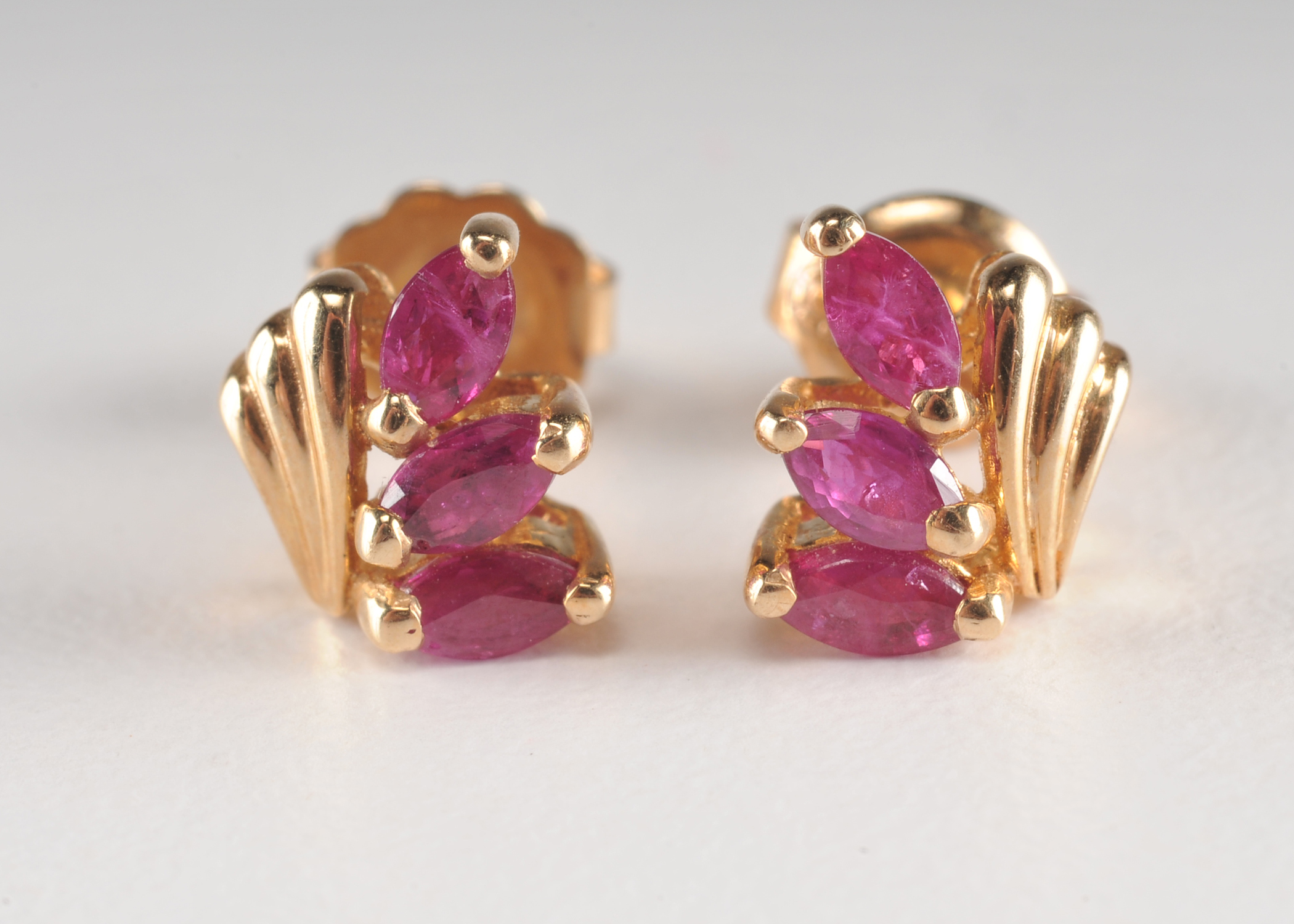 Pair of 14 K yellow gold and ruby earrings