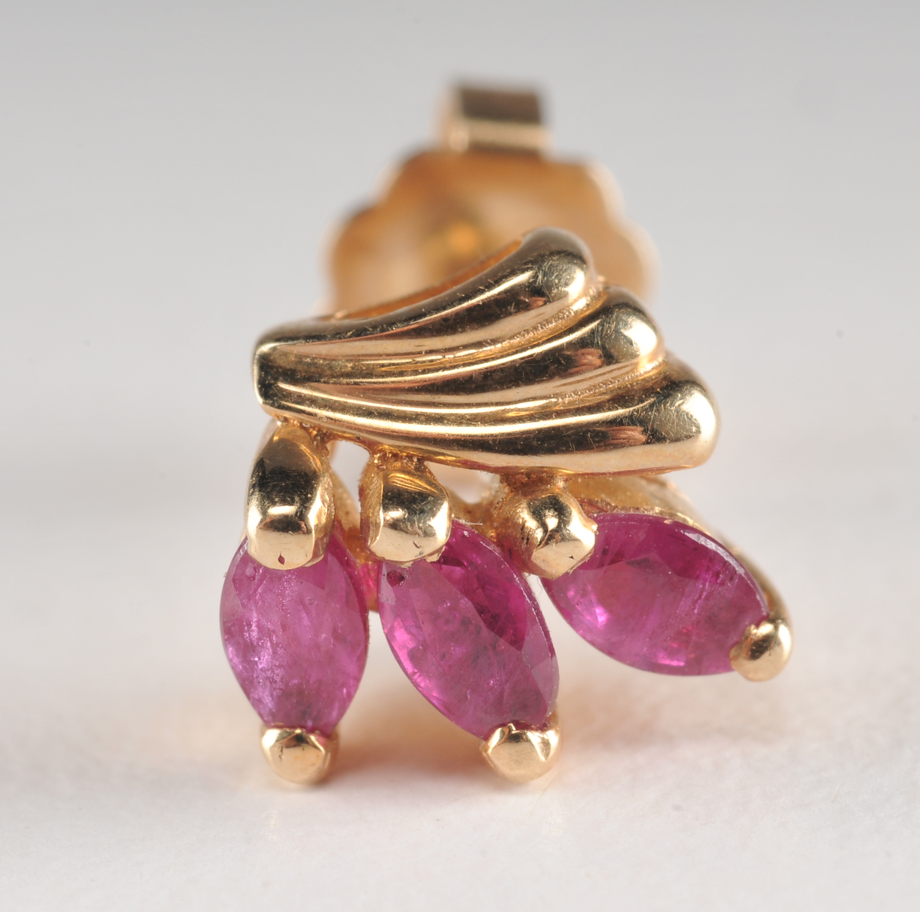 Pair of 14 K yellow gold and ruby earrings