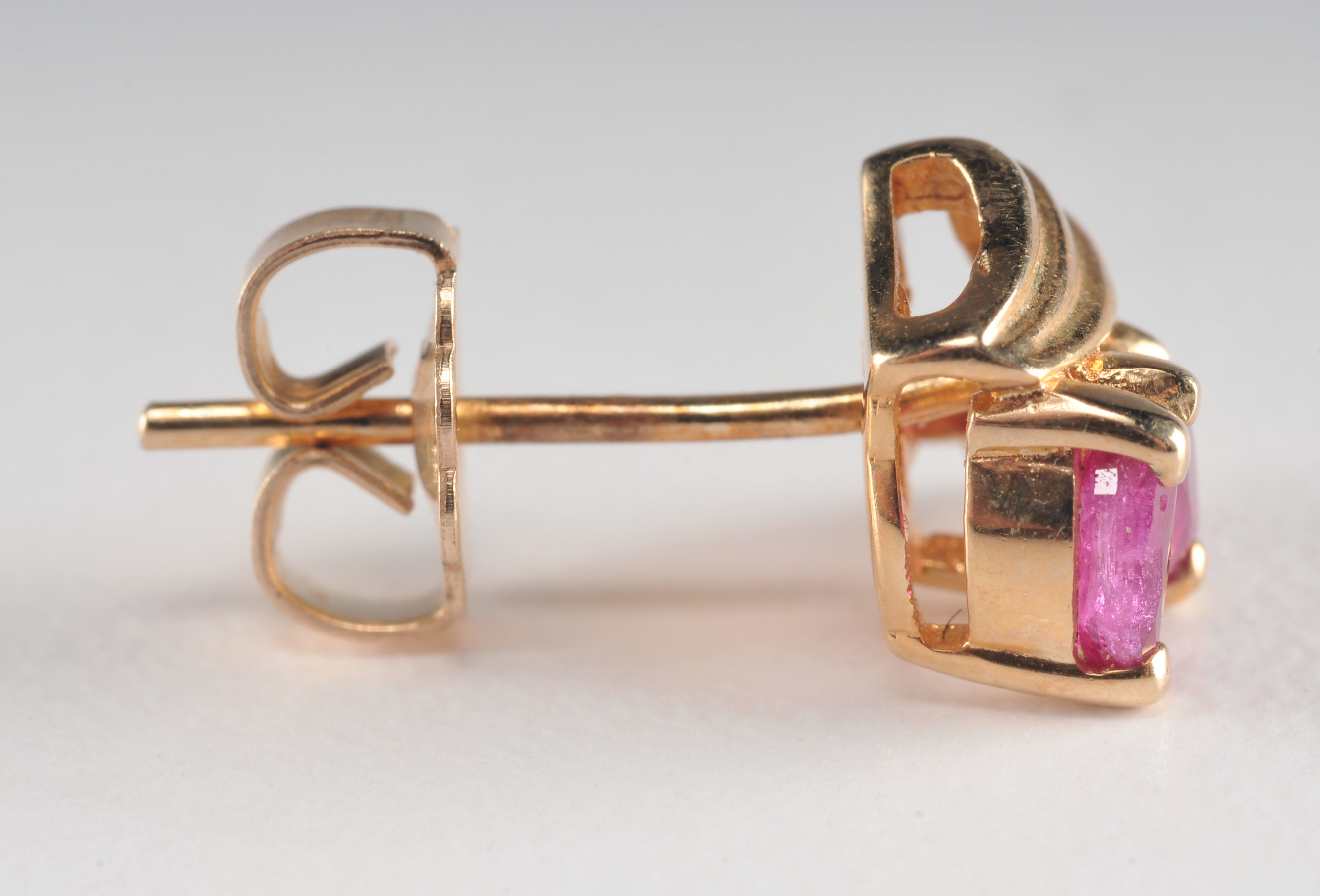 Pair of 14 K yellow gold and ruby earrings