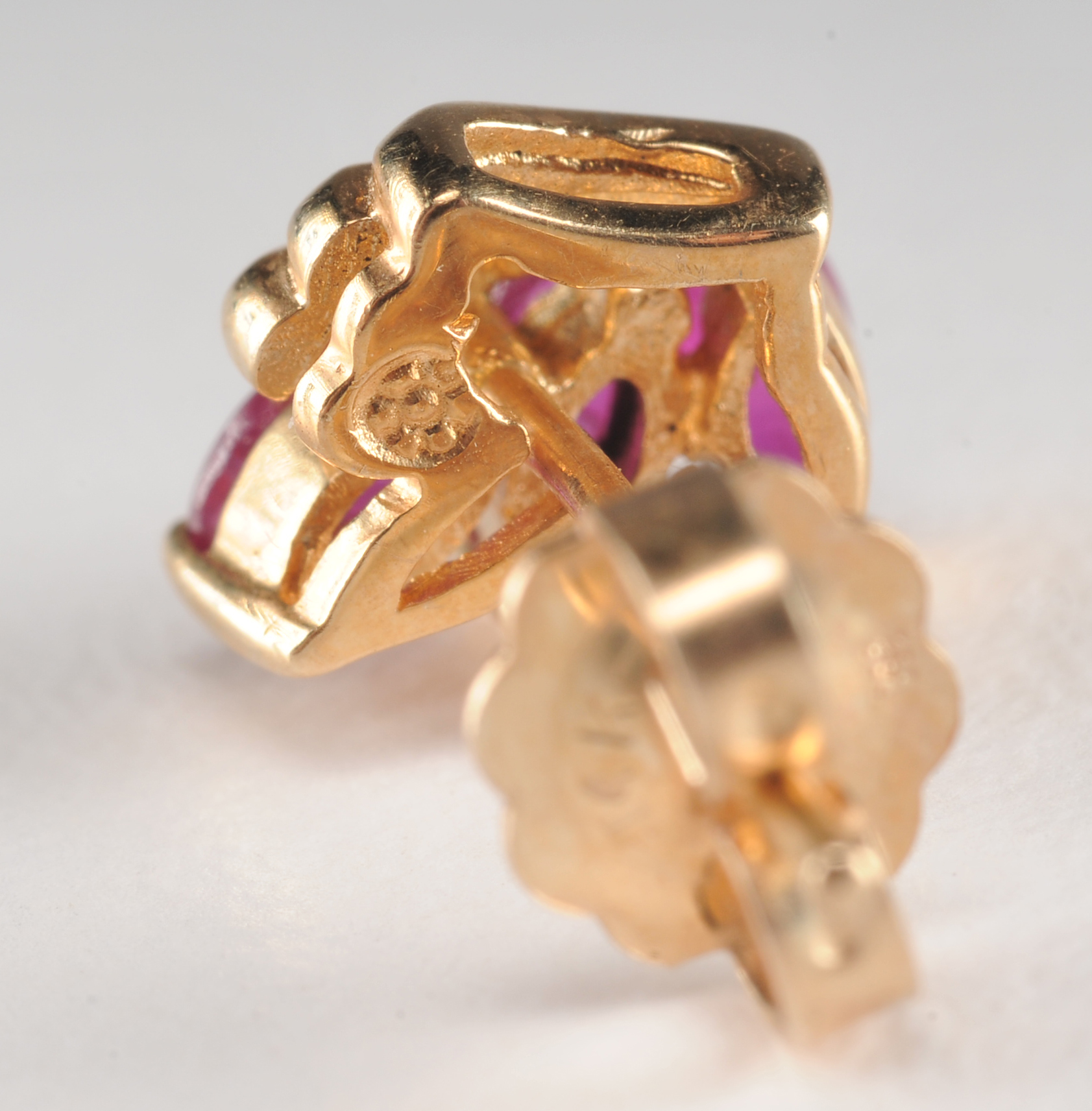 Pair of 14 K yellow gold and ruby earrings