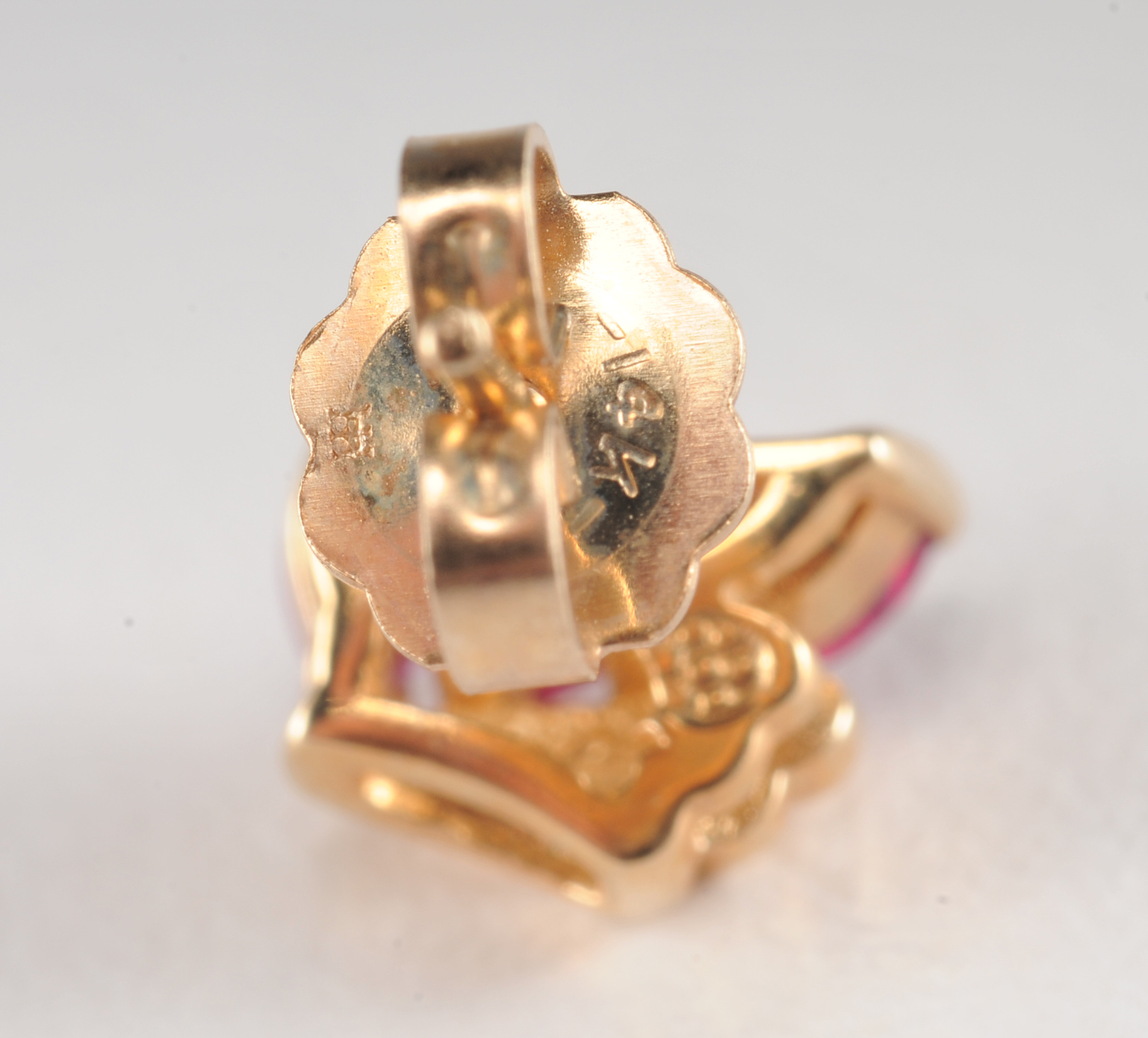 Pair of 14 K yellow gold and ruby earrings