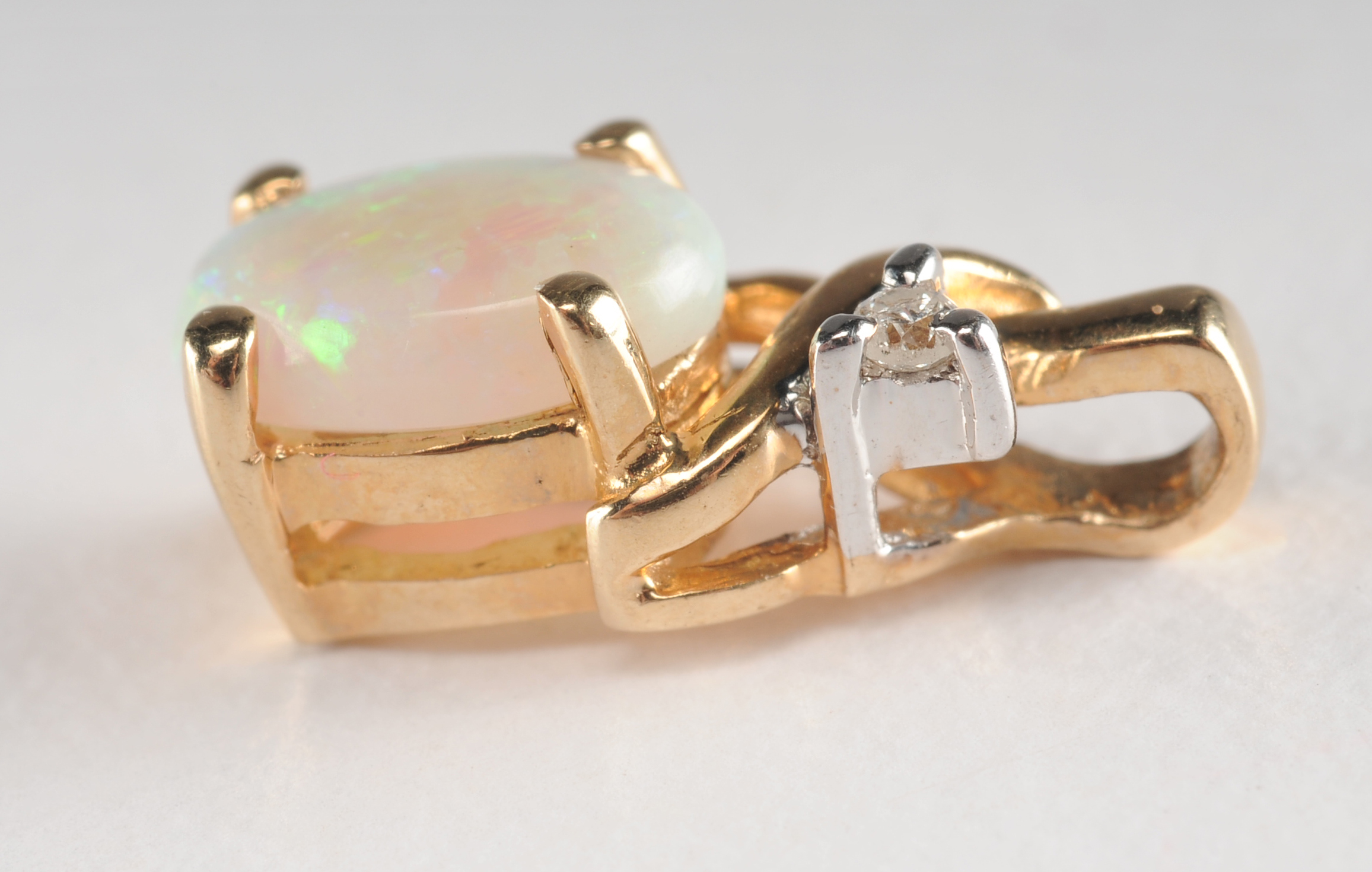 14 K yellow gold opal and diamond pendant