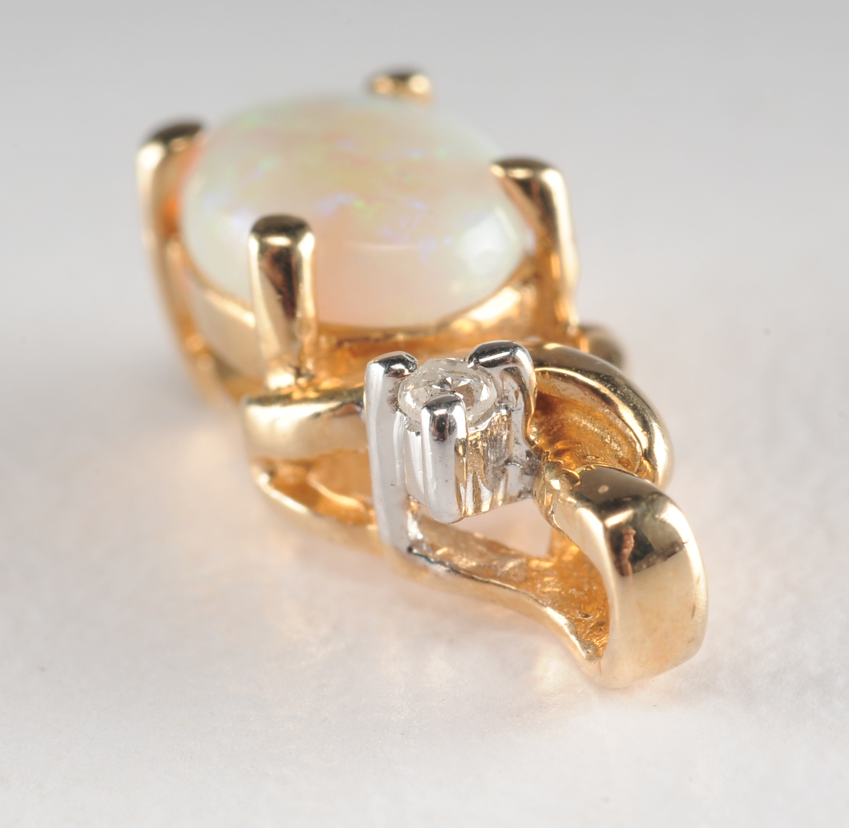 14 K yellow gold opal and diamond pendant