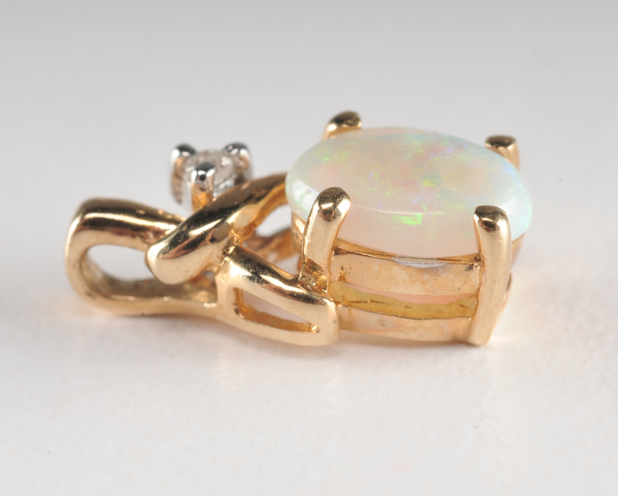 14 K yellow gold opal and diamond pendant