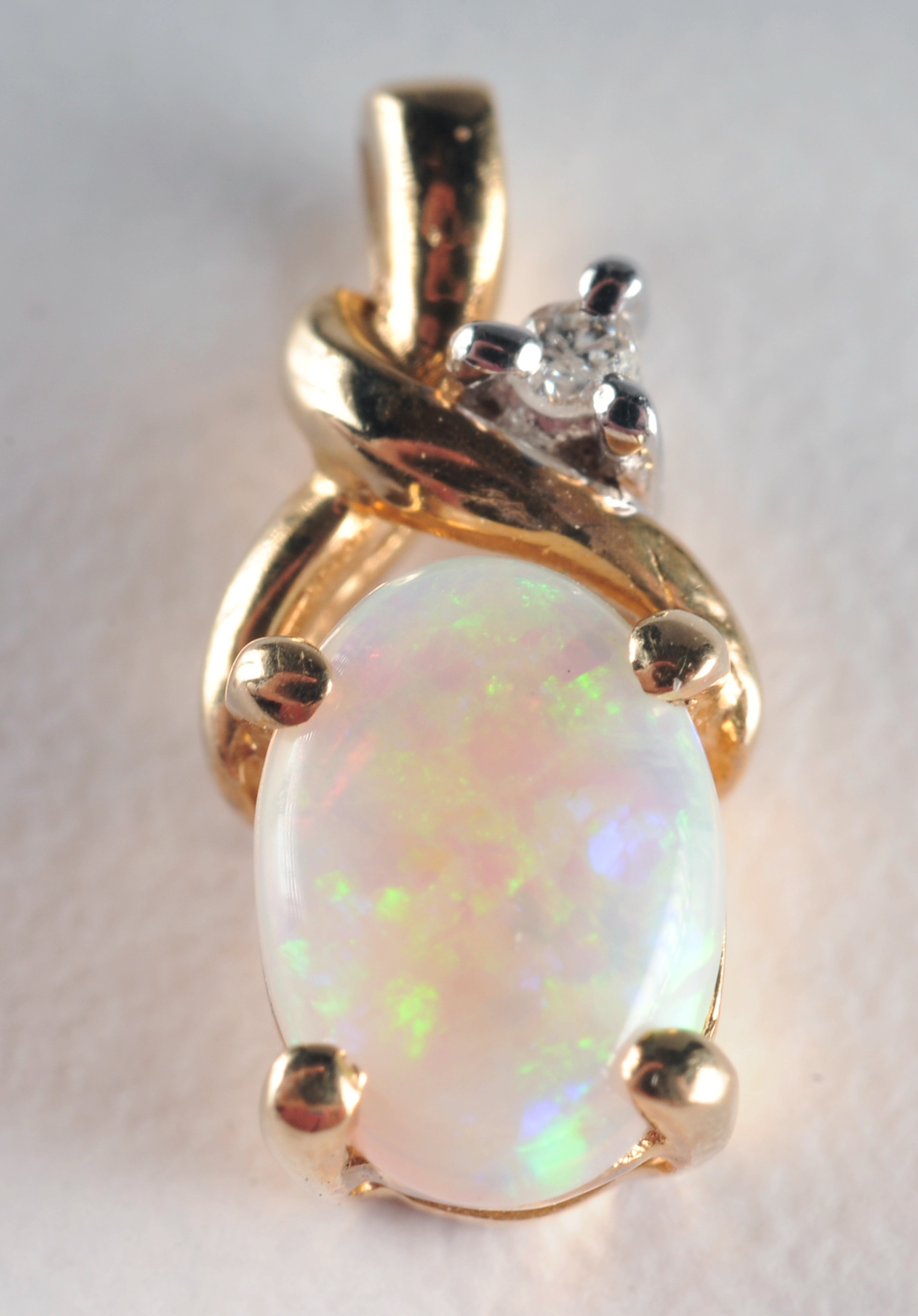 14 K yellow gold opal and diamond pendant