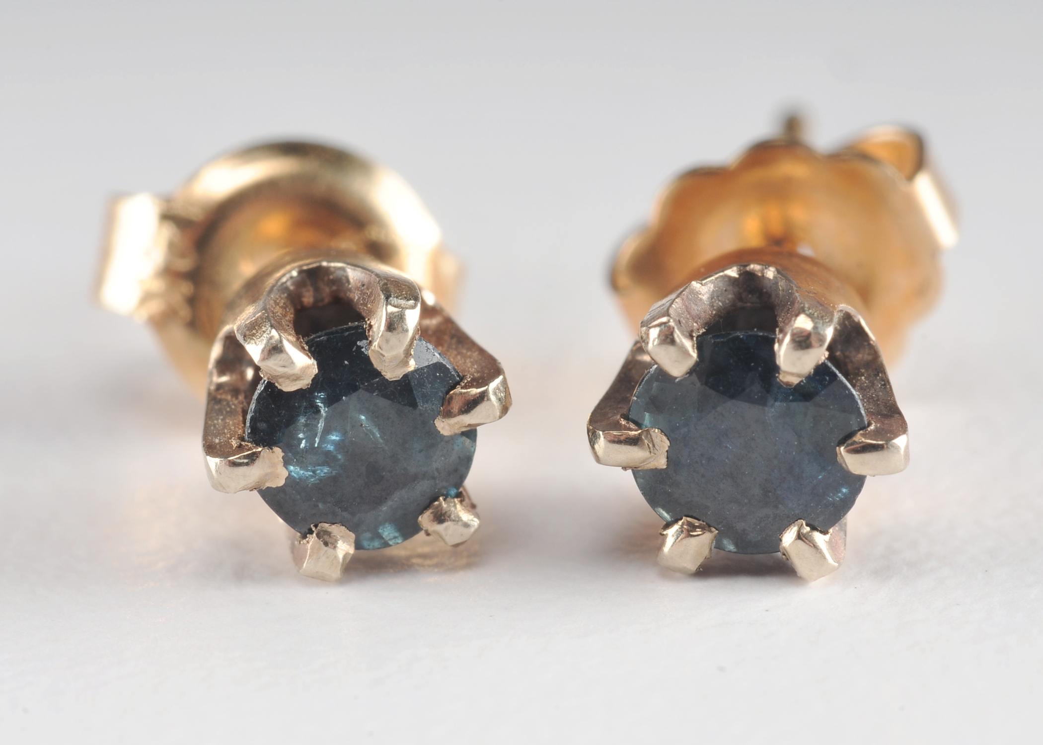 Pair of 14 K yellow gold and blue sapphire earrings