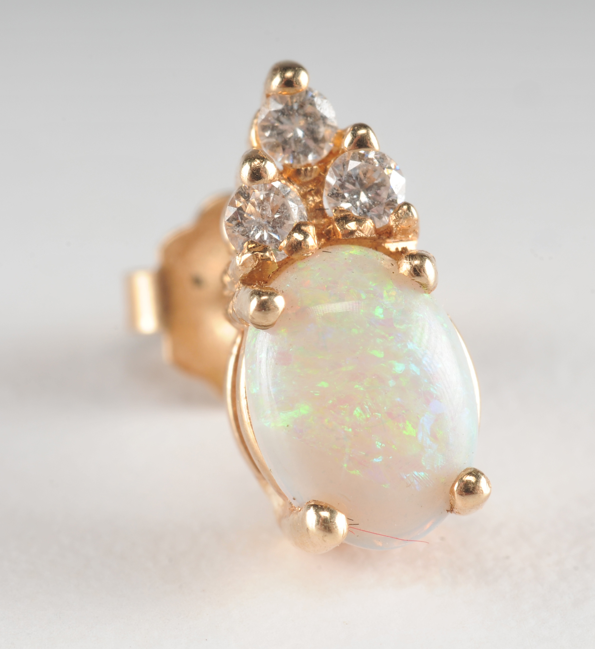 Pair of 14 K yellow gold opal and crystal earrings 