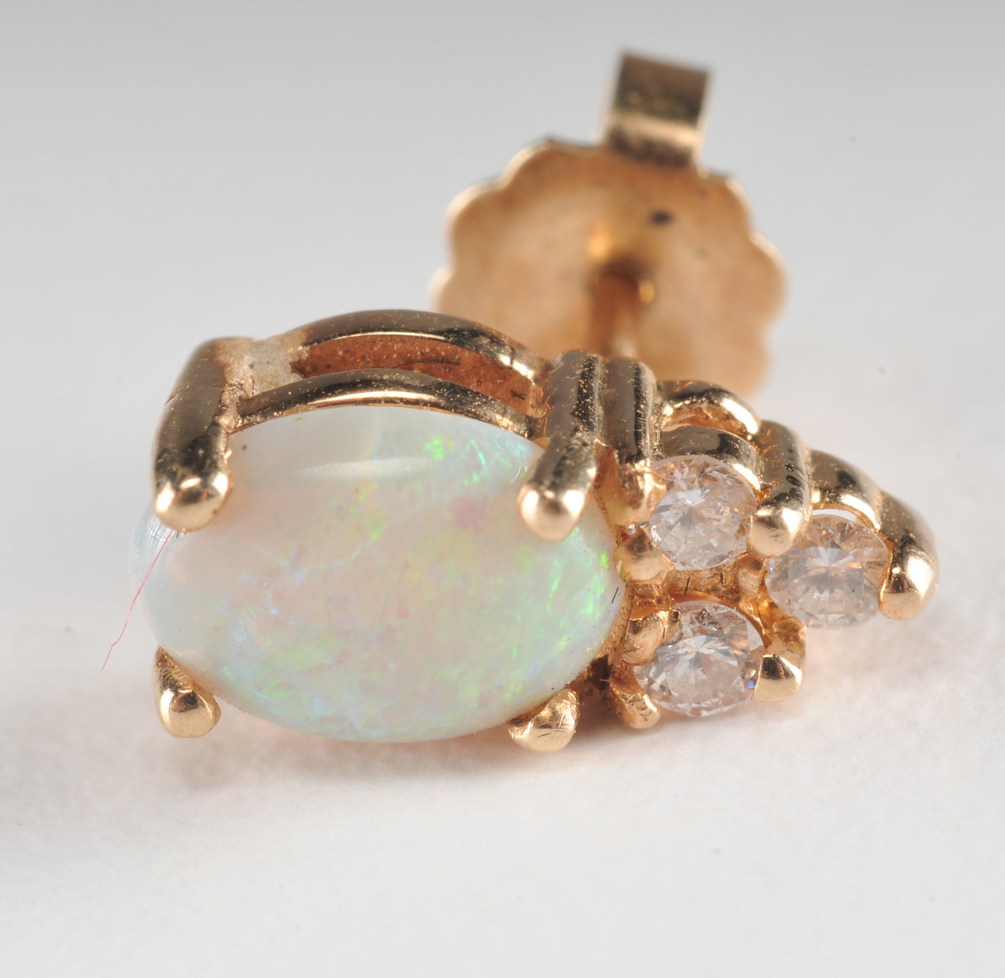 Pair of 14 K yellow gold opal and crystal earrings 