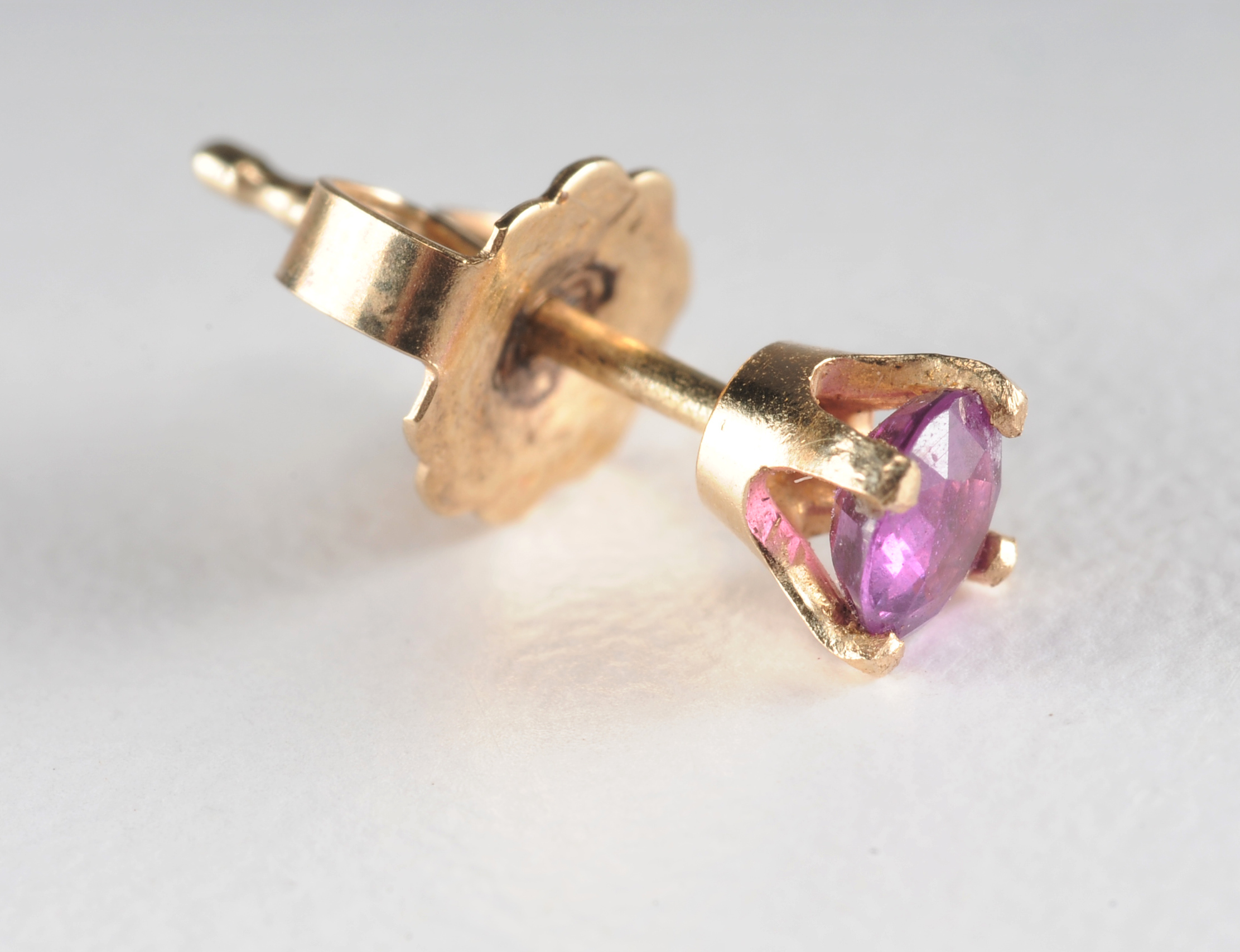 Pair of 14 K yellow gold and ruby post earrings 