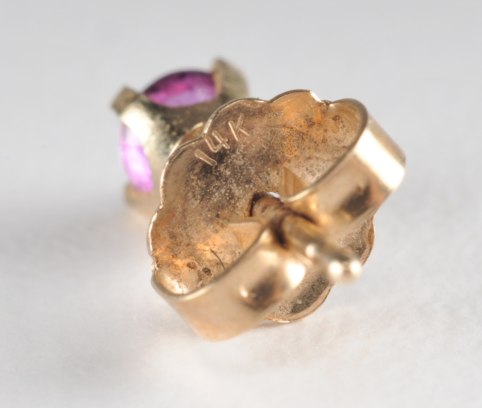 Pair of 14 K yellow gold and ruby post earrings 