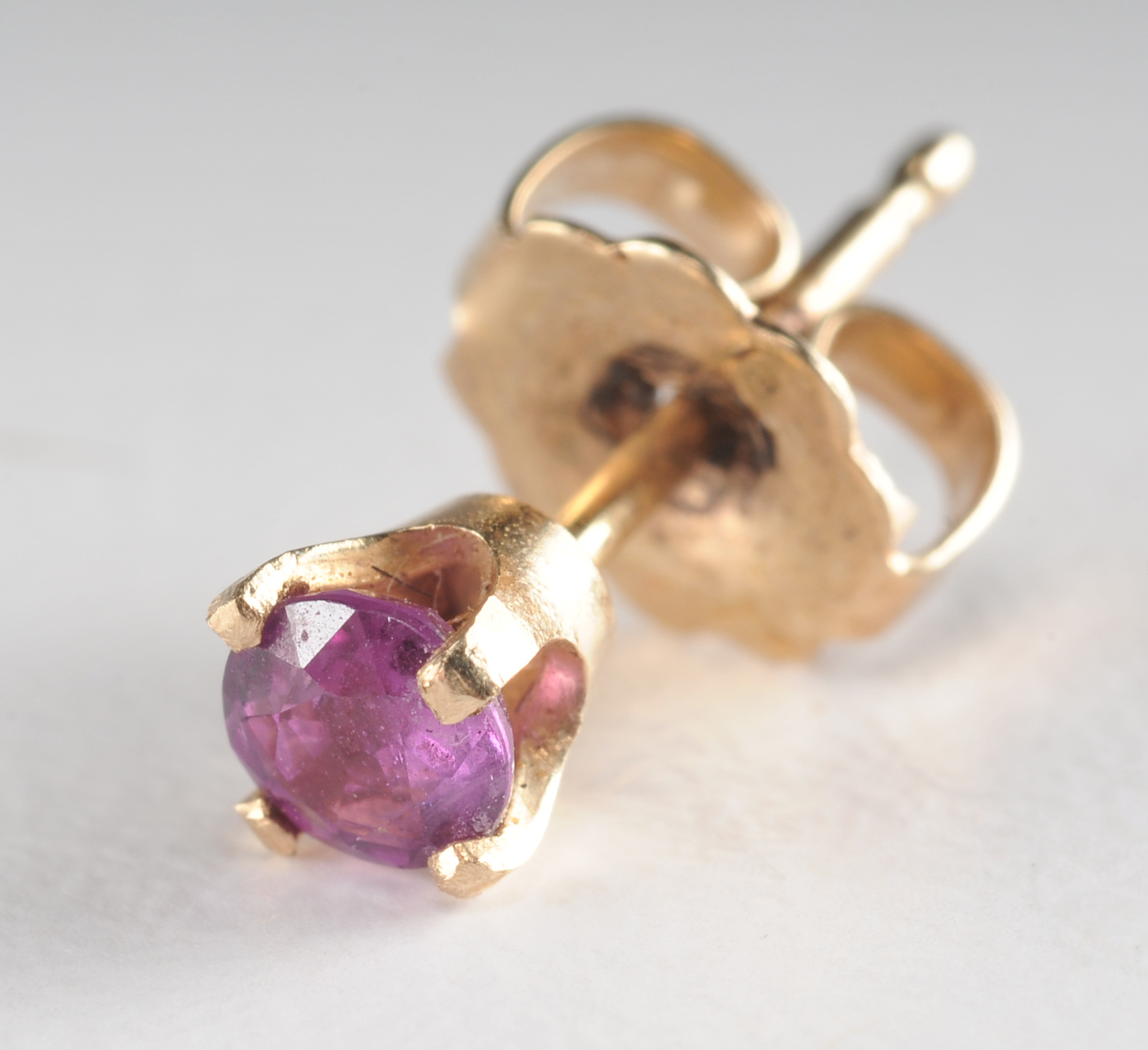 Pair of 14 K yellow gold and ruby post earrings 