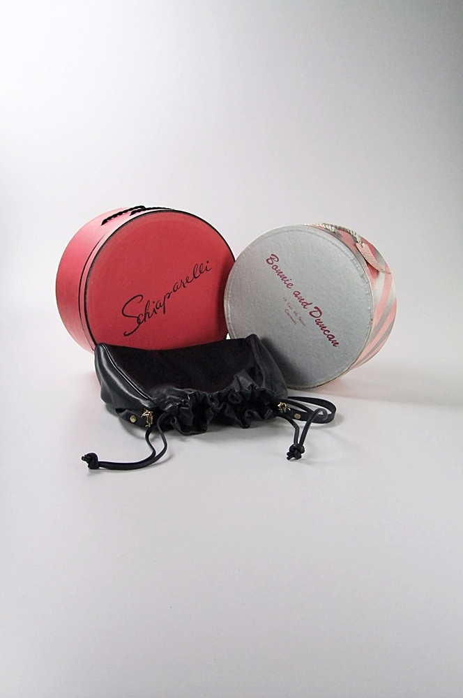 Two vintage hat boxes and a blue leather Etienne Aigner shoulderbag