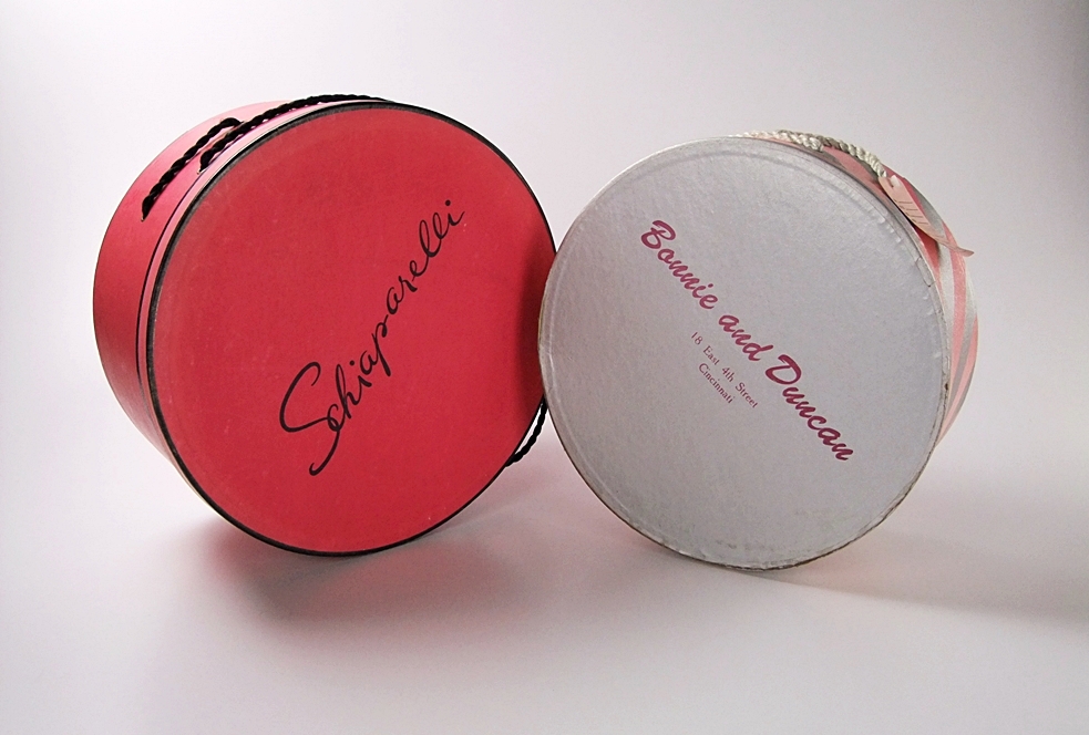 Two vintage hat boxes and a blue leather Etienne Aigner shoulderbag