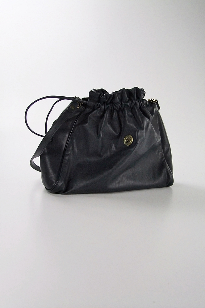 Two vintage hat boxes and a blue leather Etienne Aigner shoulderbag