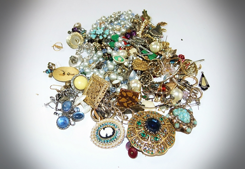 Collection of vintage jewelry and decorative items