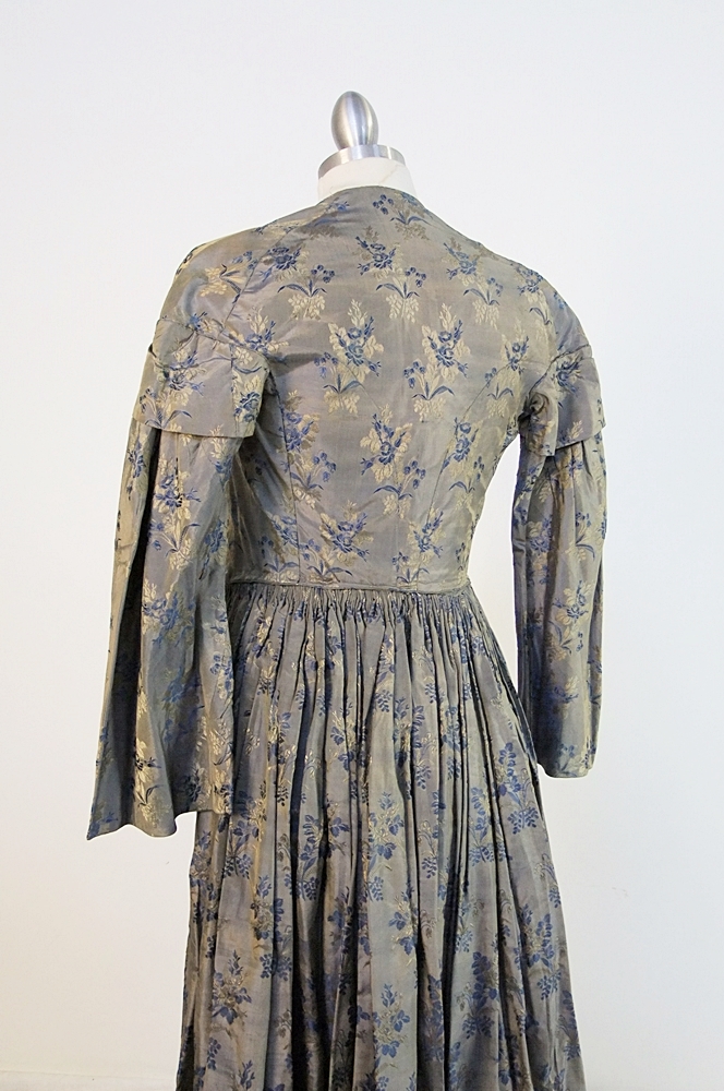 19th Century silk brocade gown in a slate blue gray with royal blue and cream floral sprays 
