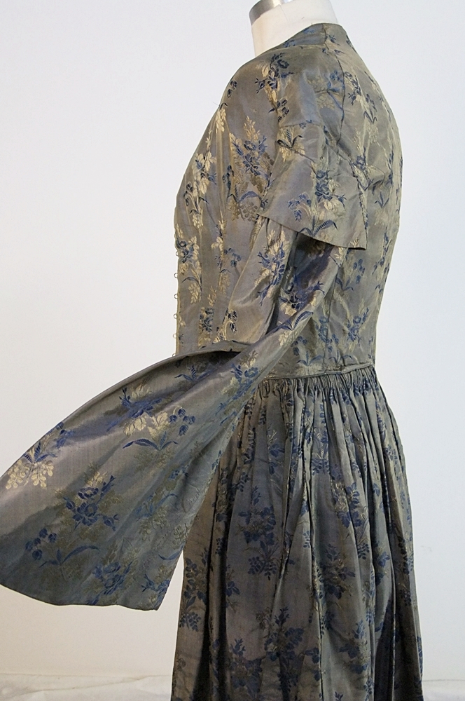 19th Century silk brocade gown in a slate blue gray with royal blue and cream floral sprays 