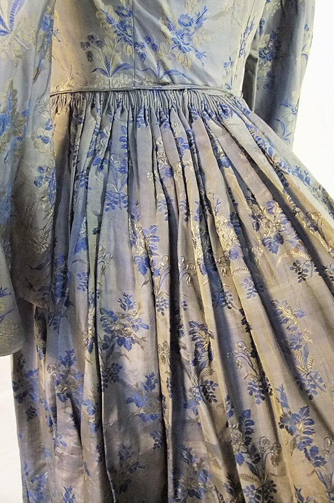 19th Century silk brocade gown in a slate blue gray with royal blue and cream floral sprays 