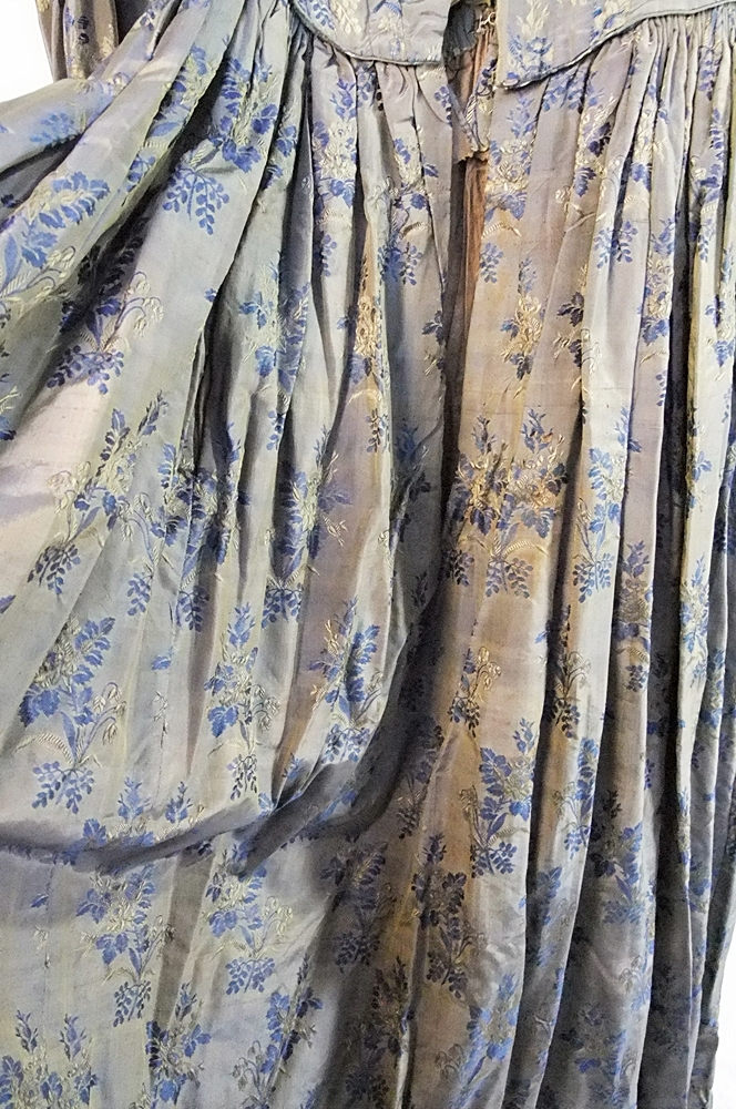 19th Century silk brocade gown in a slate blue gray with royal blue and cream floral sprays 