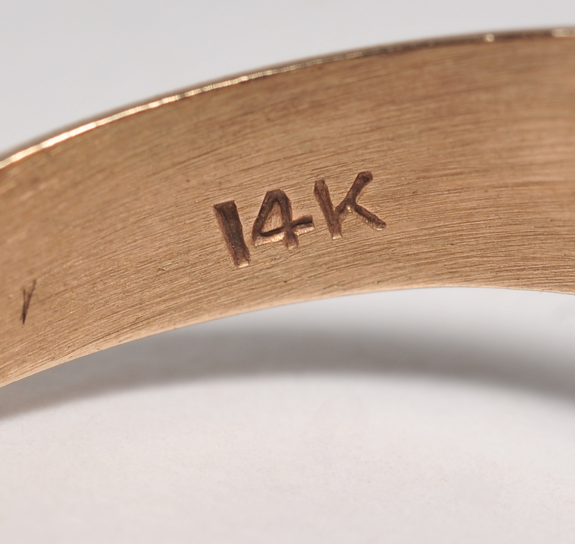 ladies 14 K yellow gold ring with blue and ruby pear shaped cabachons