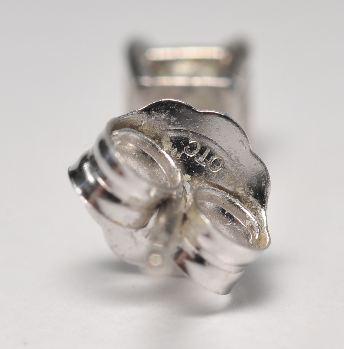 Pair of 14 K white gold and square cut diamond stud earrings 