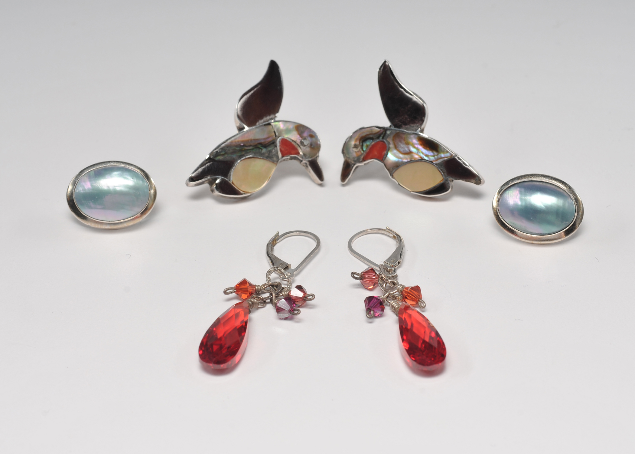 Three pair of sterling silver earrings including a pair Zuni Hummingbird earrings