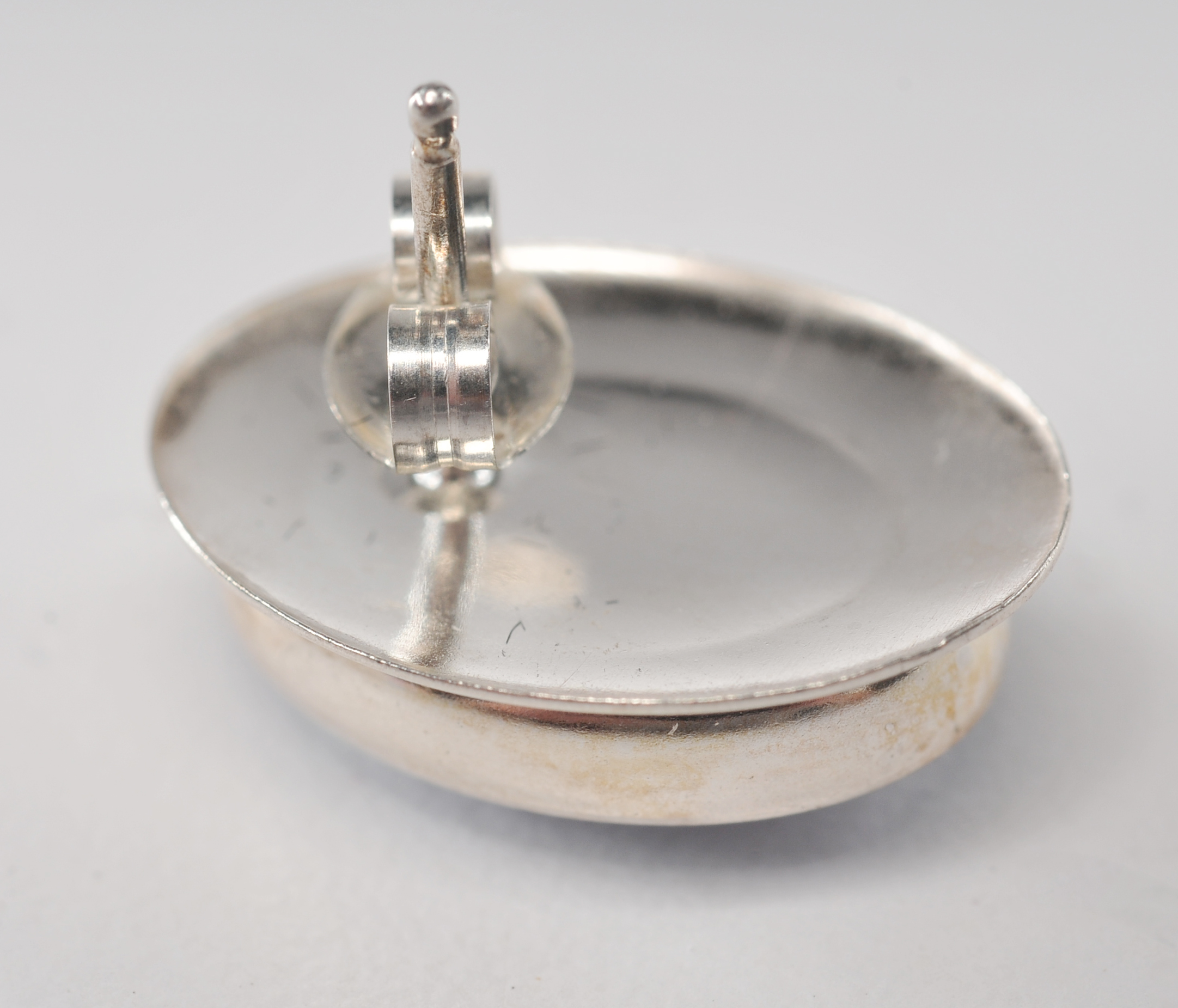 Three pair of sterling silver earrings including a pair Zuni Hummingbird earrings