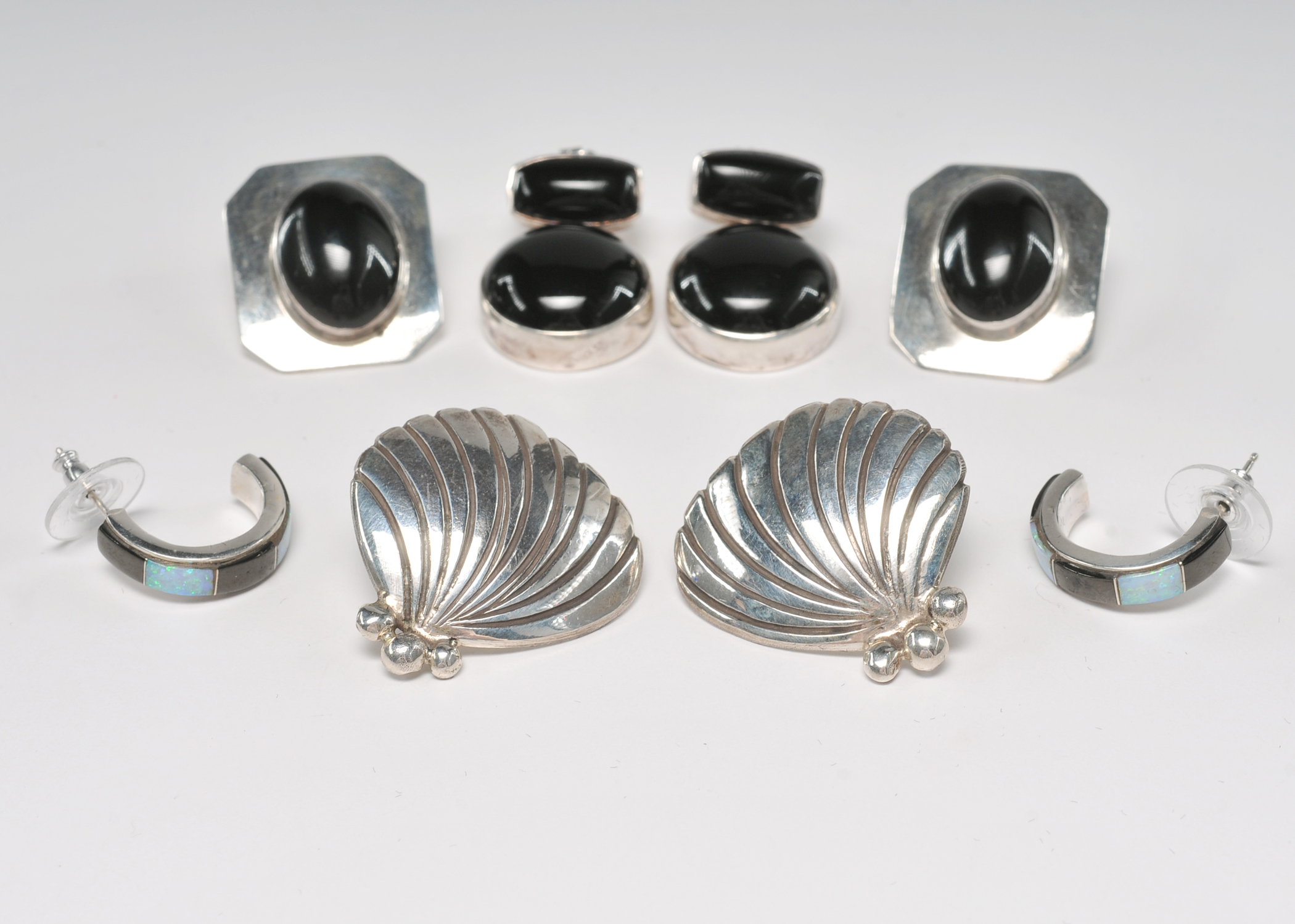 Four pair of sterling silver Navajo made post back earrings 