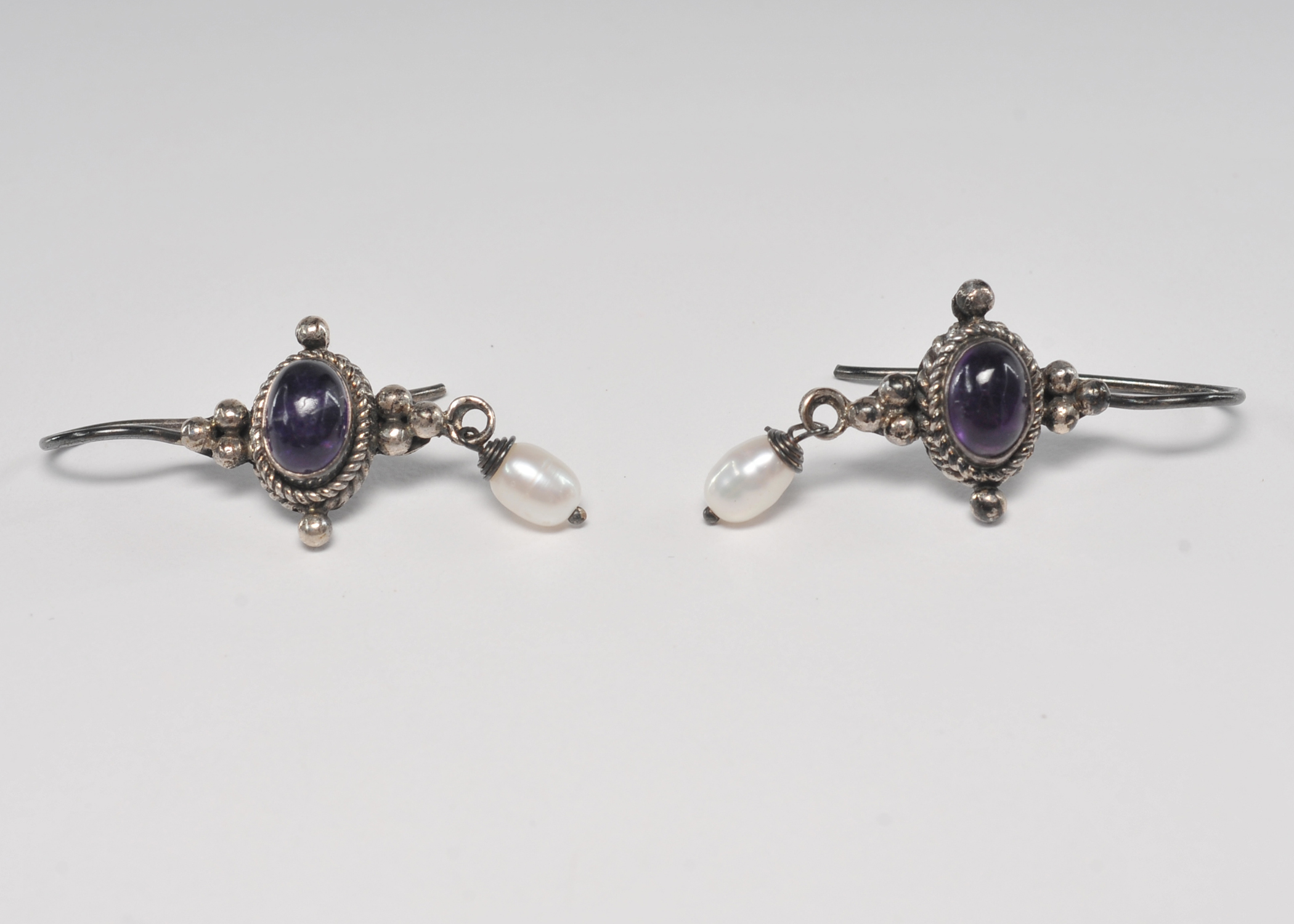 Sterling silver Balinese style amethyst earrings with dangly freshwater pearl