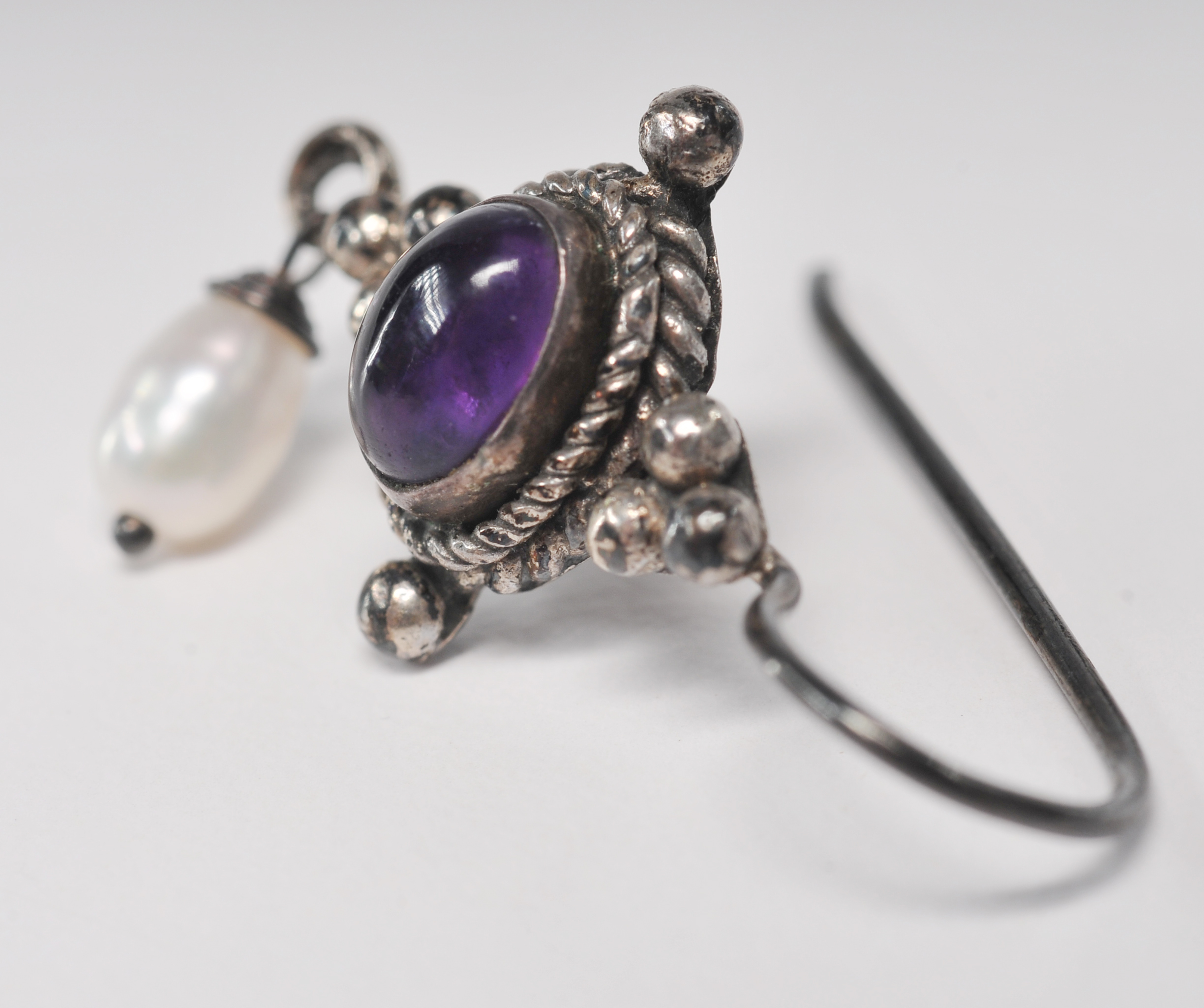 Sterling silver Balinese style amethyst earrings with dangly freshwater pearl