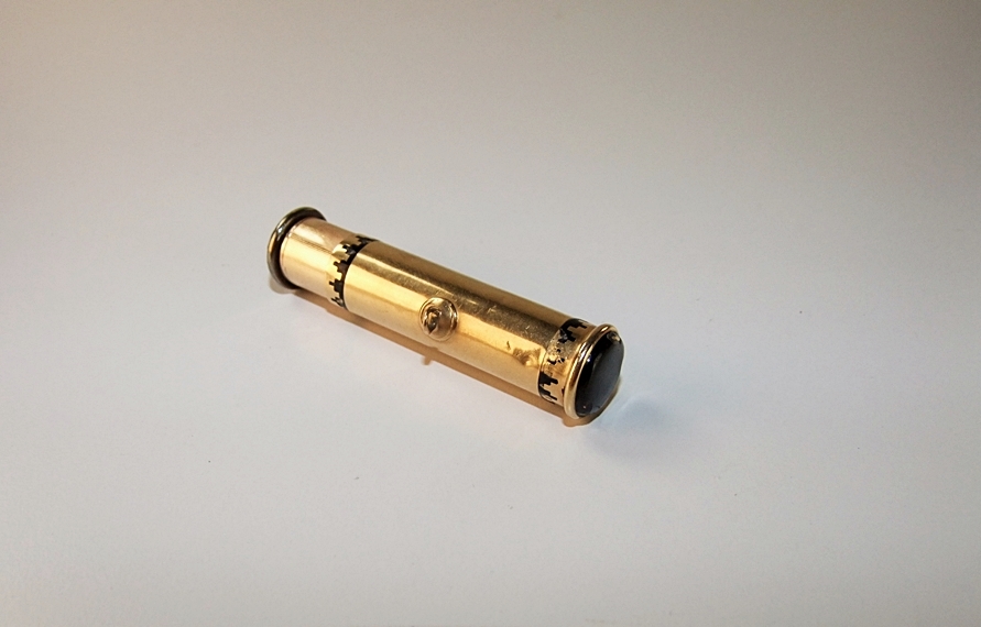 Cartier 18 K yellow gold and black enamel lipstick case pendant