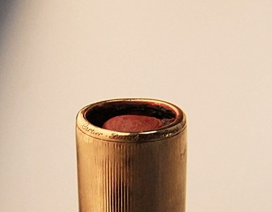 Cartier 18 K yellow gold and black enamel lipstick case pendant